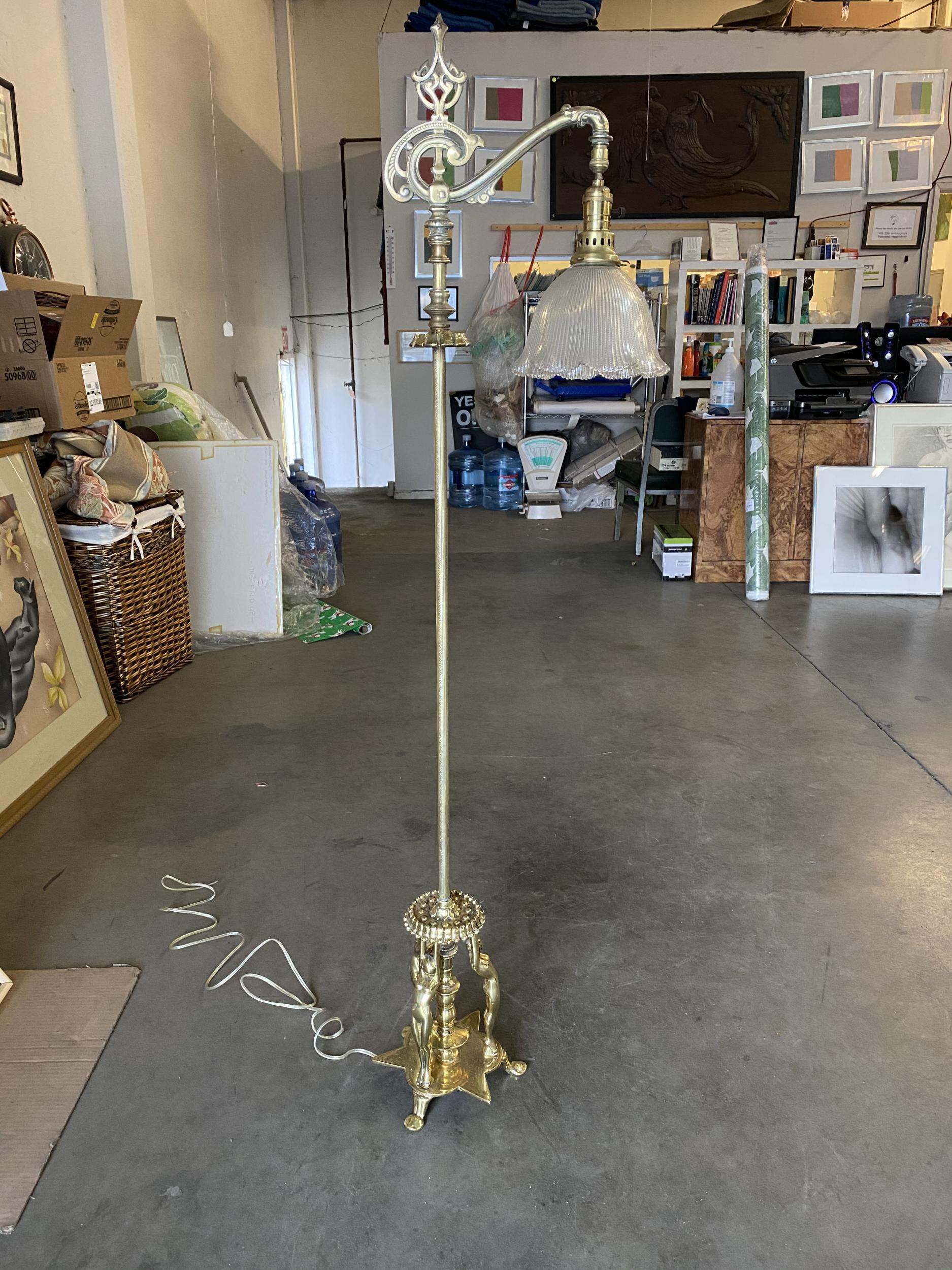 Rare1930s Frankart reading floor lamp with a base featuring three nude nymphs.

The reading lamp comes with a 1920s period decorated glass shade

Frankart Inc.

Arthur Frankenberg began designing and producing bookends in New York City in 1921. In