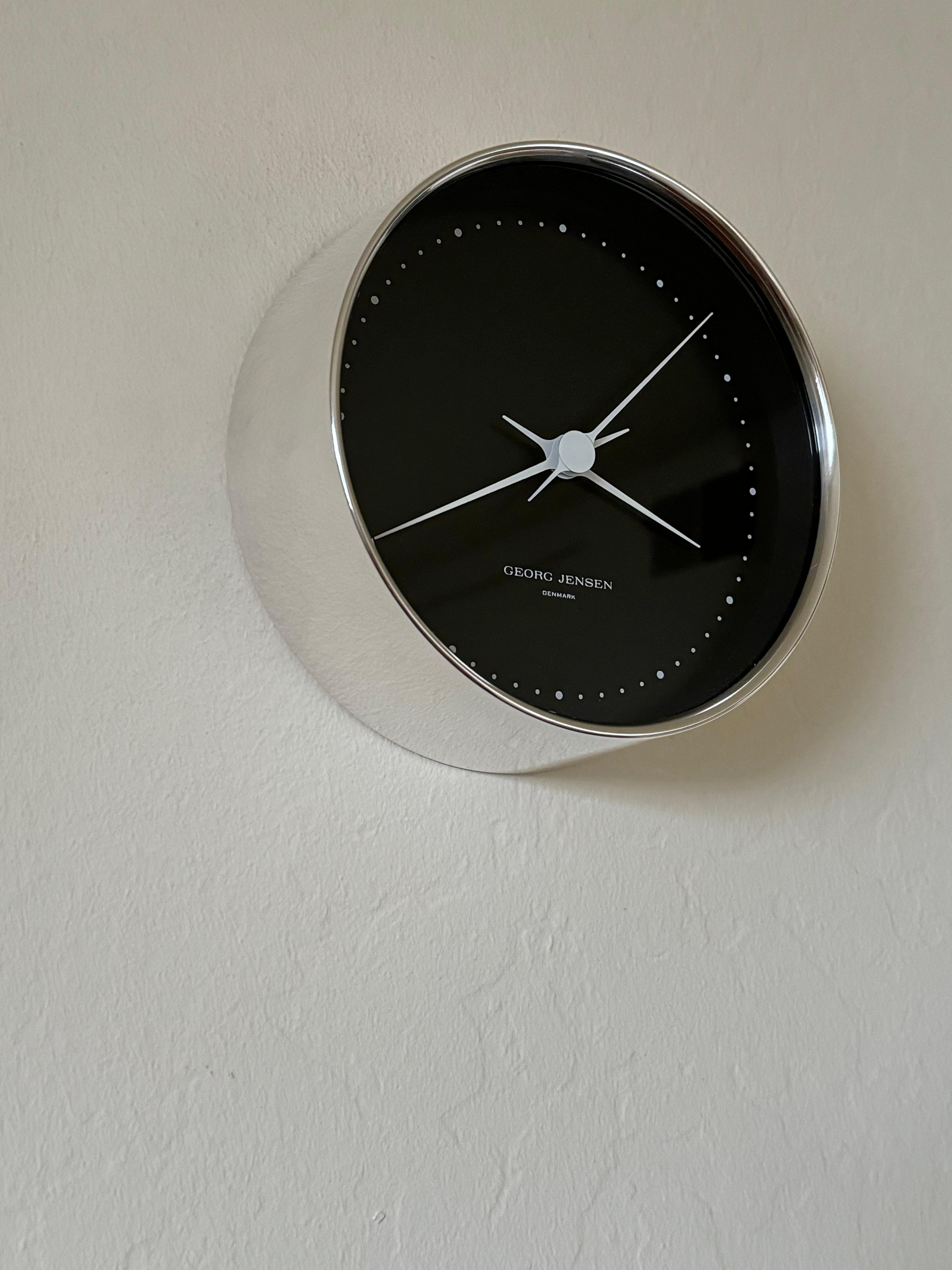 An extremely rare solid sterling silver wall clock model HK A11 designed by Henning Koppel and created by Georg Jensen of Denmark. A never used wall clock by Henning Koppel, kept in its original box with all it's paperwork since new, in mint