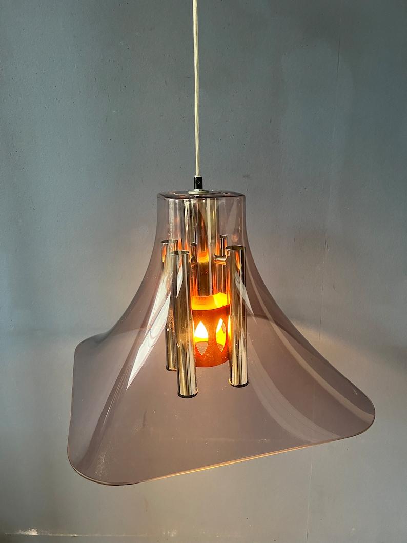 Very rare space age pendant lamp with an acrylic glass outer shade and a chrome inner frame. The acrylic shade is clear but has a purple-like touch to it. The inner part is made of chrome metal and has also an orange part. Together these elements