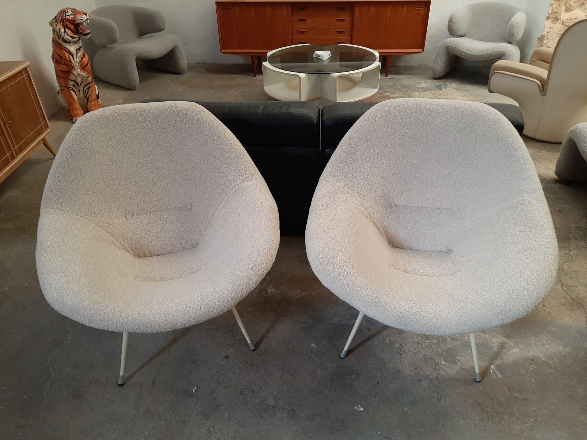 A pair of very unique midcentury armchairs from the 1950s Spanish design, possibly from the Hermanos Vidal S.A. or also known as VVV, they were the Spanish leaders in the manufacture of avant-garde furniture of the era. 

This gorgeous set was