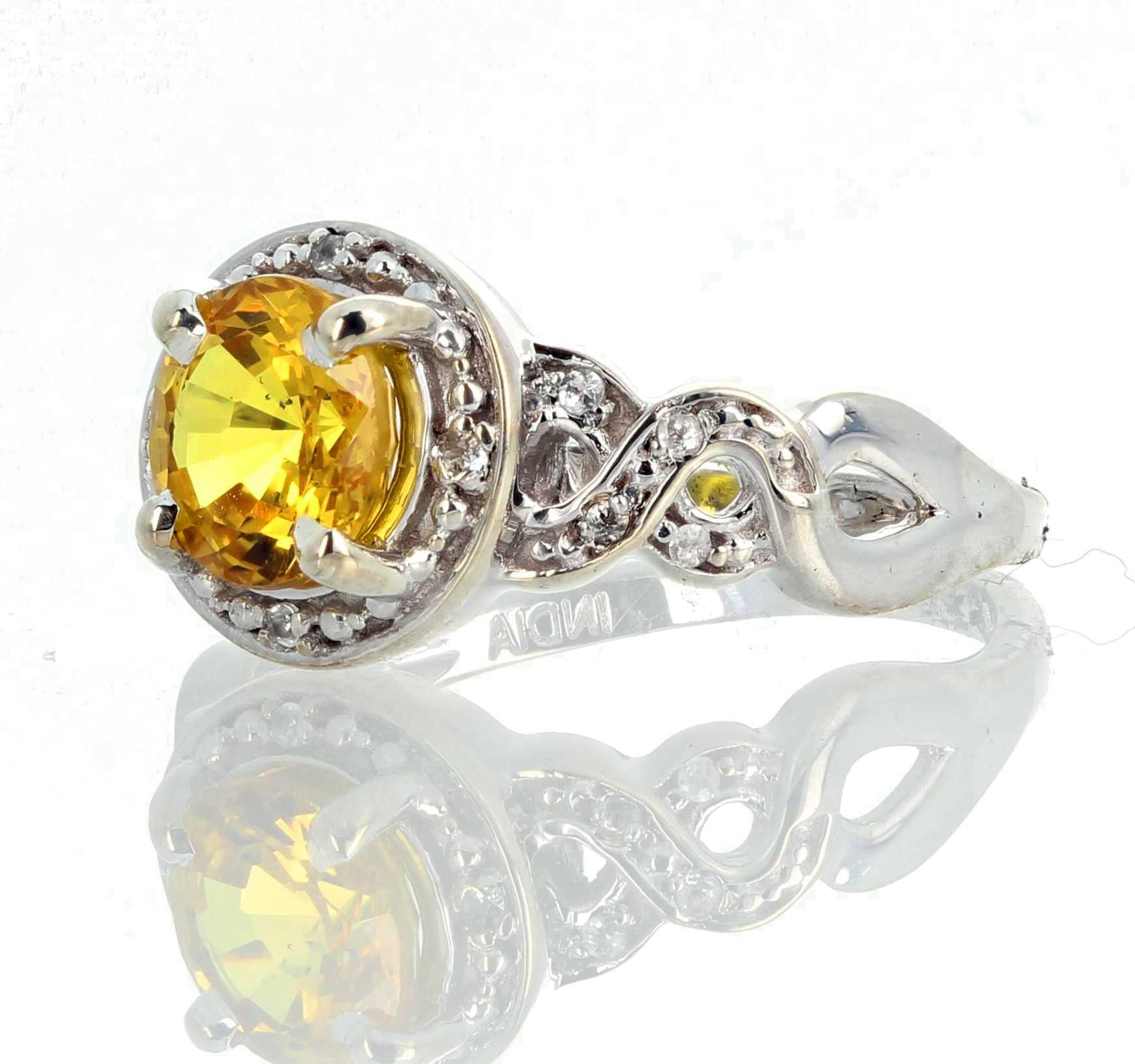 Very rear intense brilliant yellow 1.3 Carat (7 mm) Spinel enhanced with teeny tiny white Diamonds set in this lovely sterling silver platinum plated ring size 7.5 sizable for free.   This sparkles intensely for evening events.   