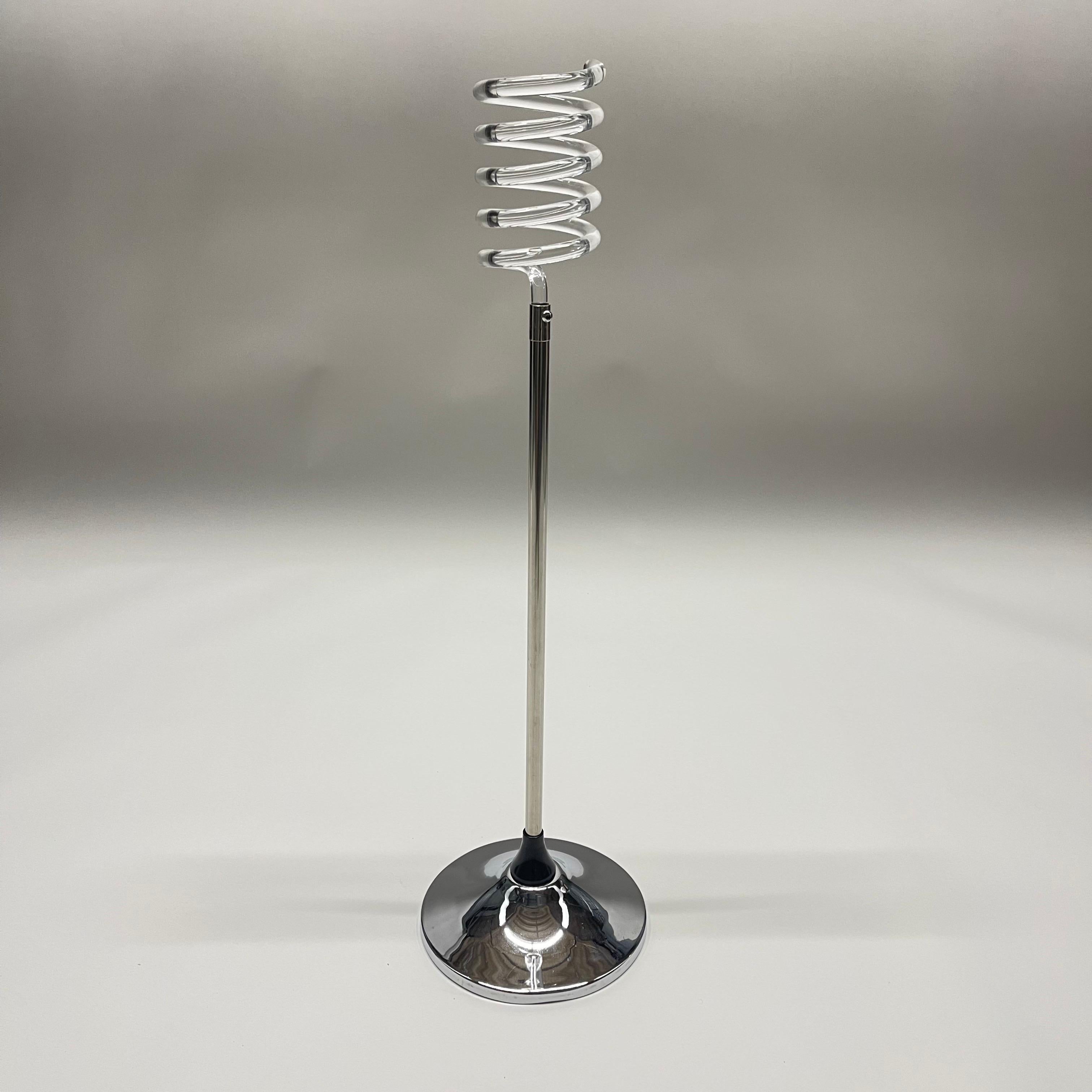 Mid century Art Deco wine holder stand rendered in spiral twisted polished lucite and chrome plated steel, attributed to Dorothy Thorpe.