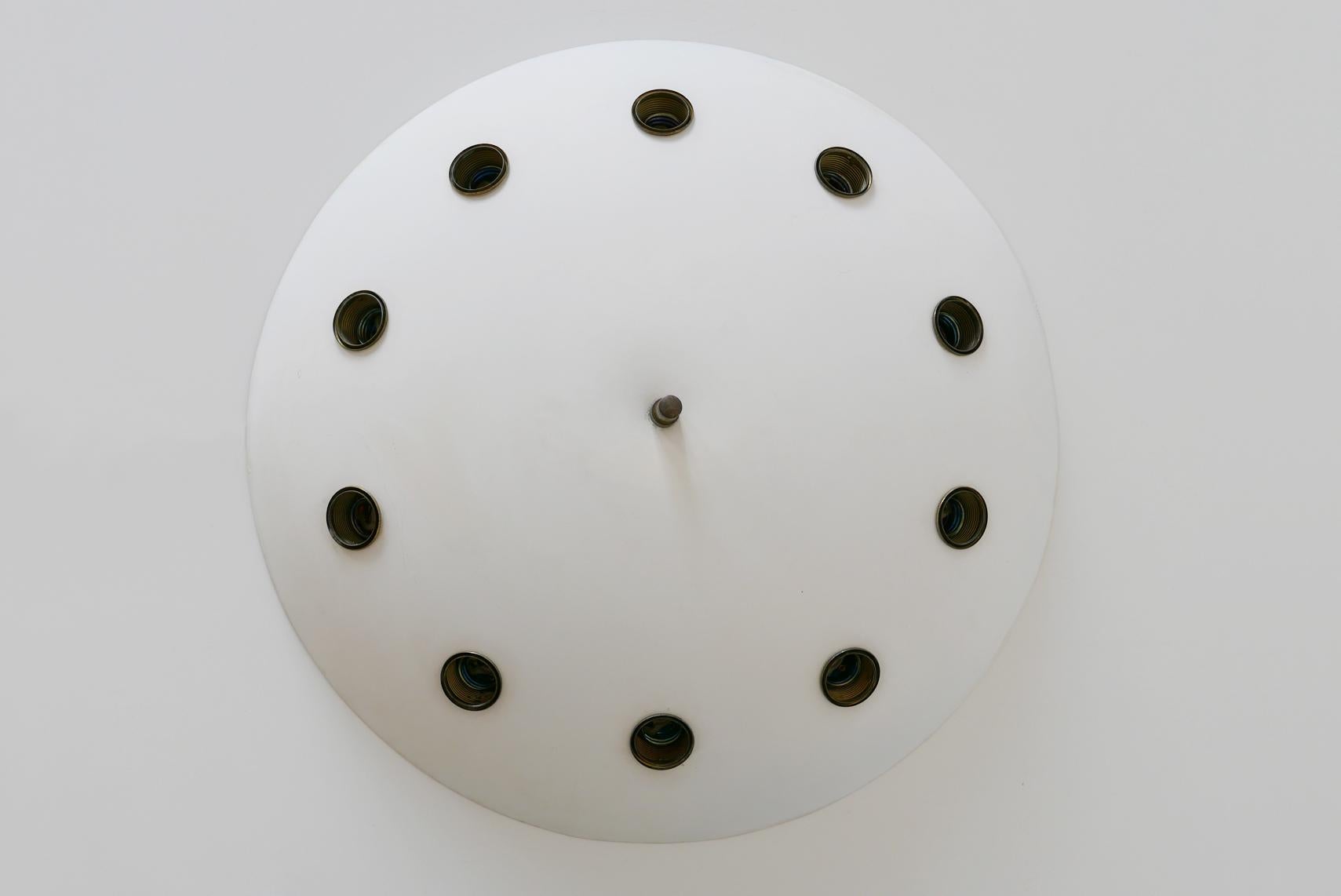Exceptional Mid-Century Modern Sputnik flush mount or ceiling fixture. Designed probably by Oscar Torlasco for Lumi, 1950s, Italy.

Executed in white lacquered aluminum, the ceiling fixture needs 10 x E27 Edison screw fit bulbs, is re-wired, and in
