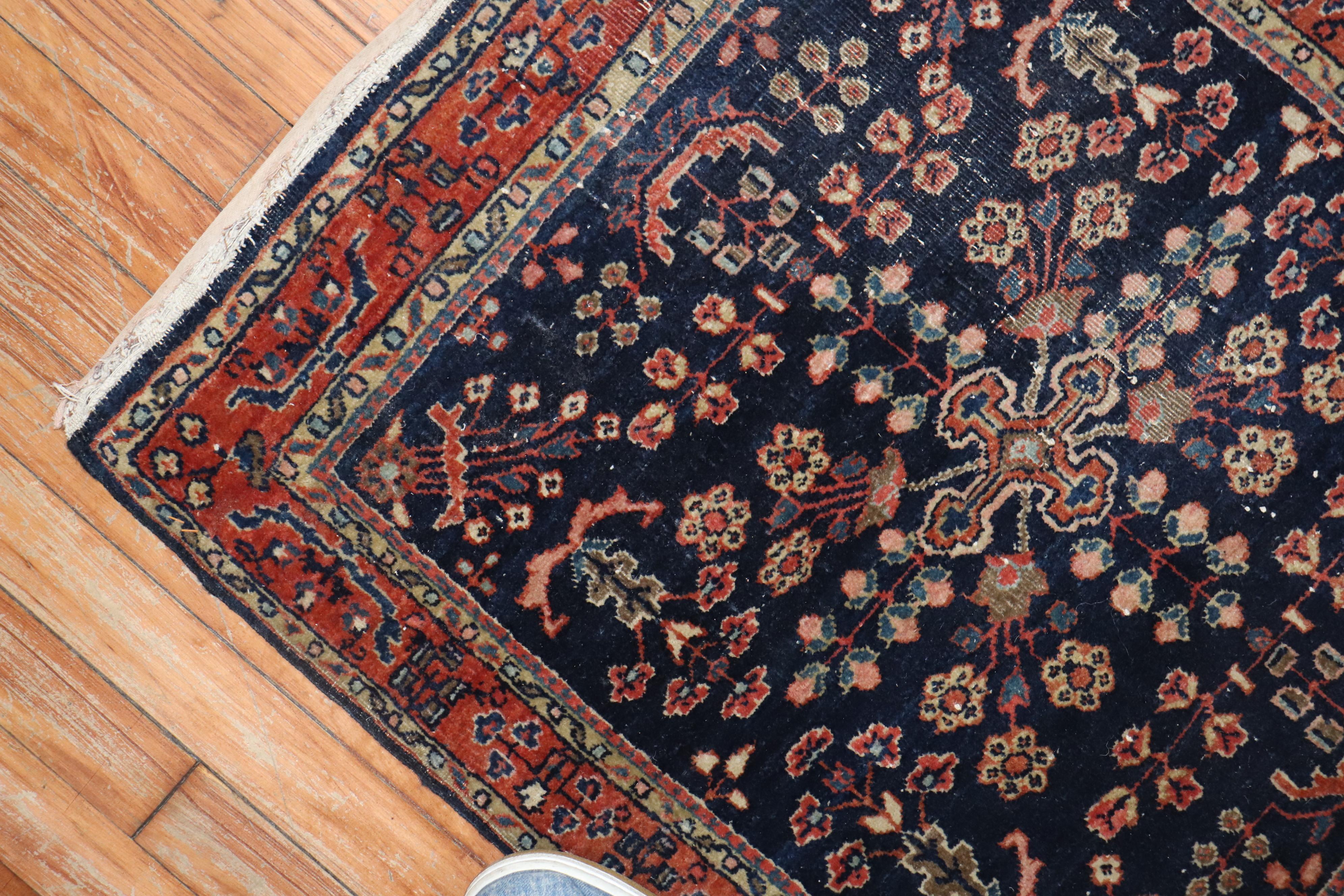 An authentic early 20th century Sarouk carpet with traditional formal design in rare square size.

Measures: 2'2