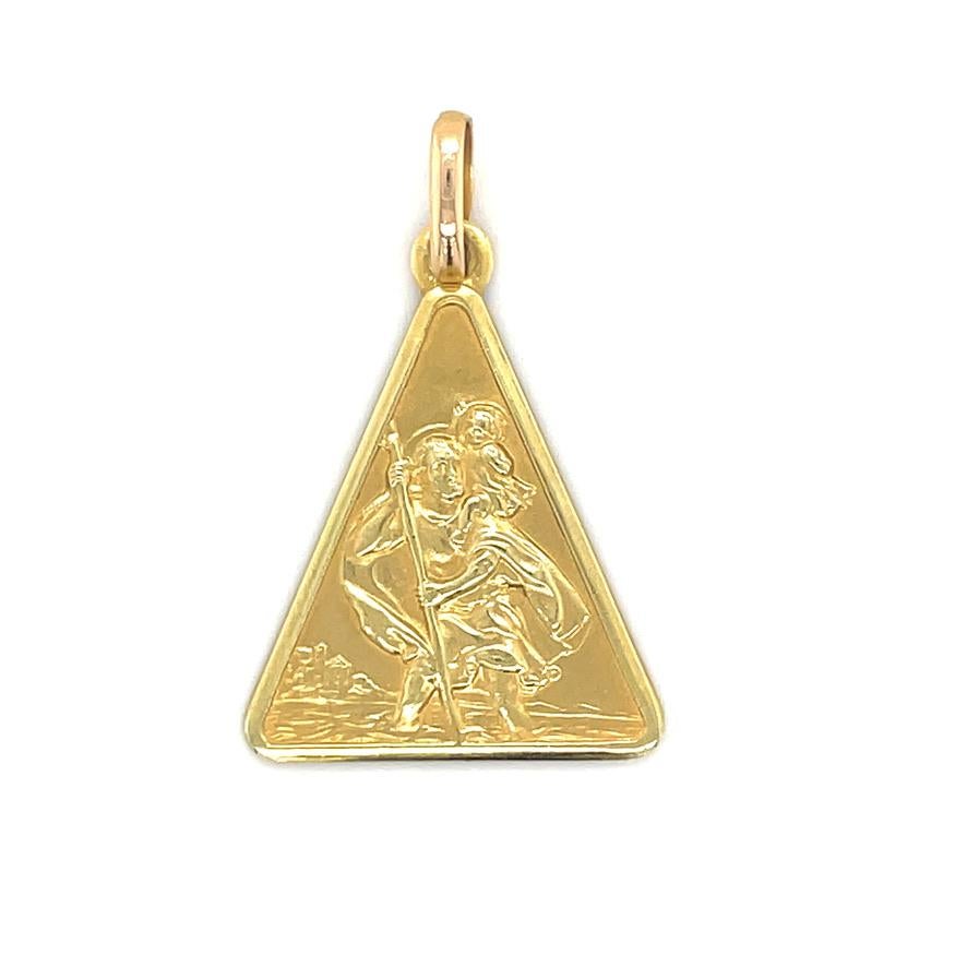 Distinctive configuration for a St. Christopher's medal:  an elongated triangle.  Solid gauge 18K yellow gold.  Exceptionally crisp condition; beautifully detailed.  3/4