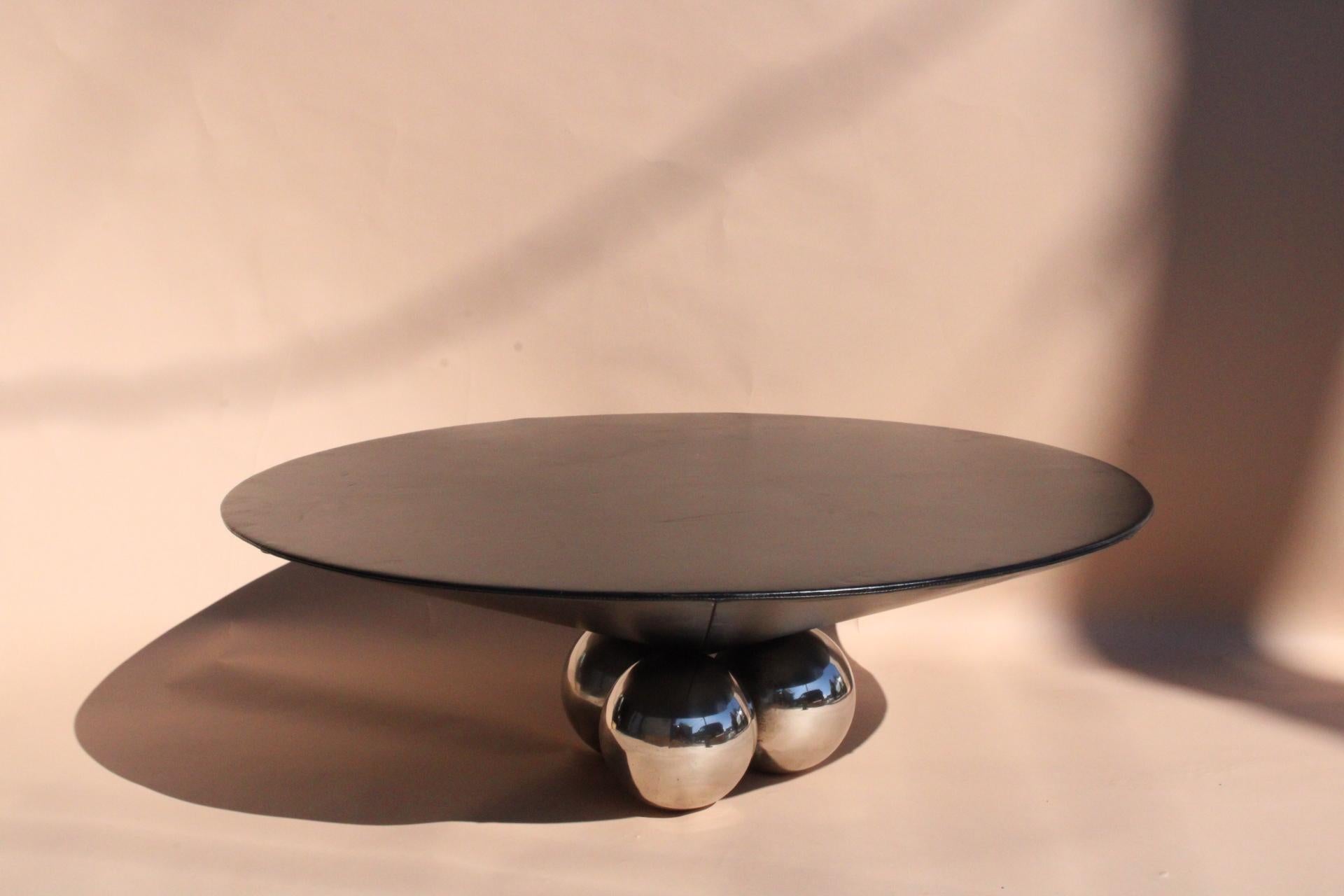 A stunning and rare to acquire iconic leather stitched conical table atop heavy solid steel chrome balls, with optional round glass to protect leather surface. This memphis style  ‘bocci’ design by Stanley Jay Friedman for Brueton, Is everything