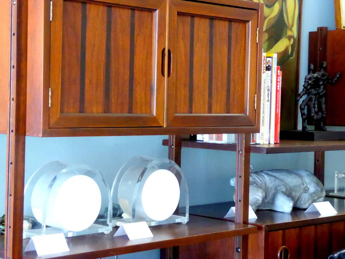 A rare original Stanley wall unit or room divider. In three sections with five modules and four shelves. Adjustable to any configuration. Leveling feet to fit the variations in your floor. Alternating walnut and we believe rosewood veneers. A rich,