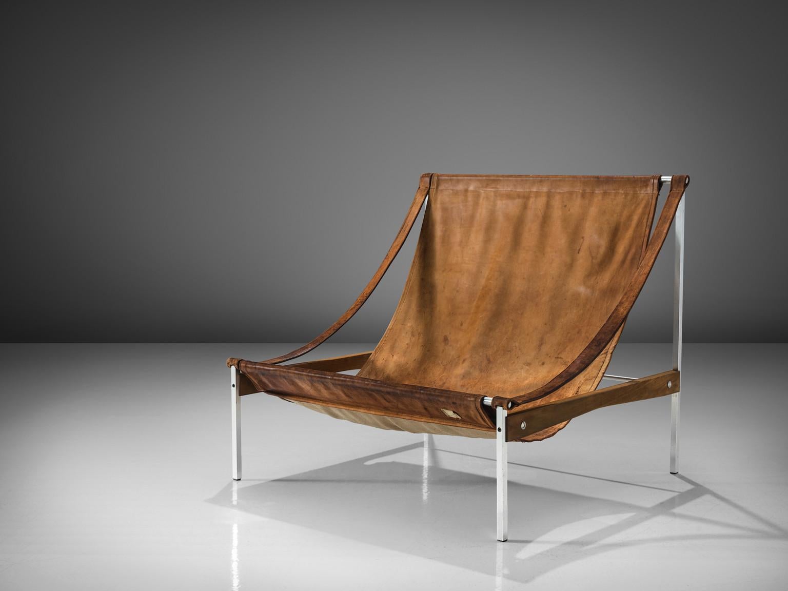 Stig Poulsson, lounge chair, model 'Bequem', leather, aluminum, ash, Denmark, designed 1968-1969

This 'Bequem' lounge chair is designed by Stig Poulsson. The most striking feature of this extraordinary chair is its sheer size. The width of this