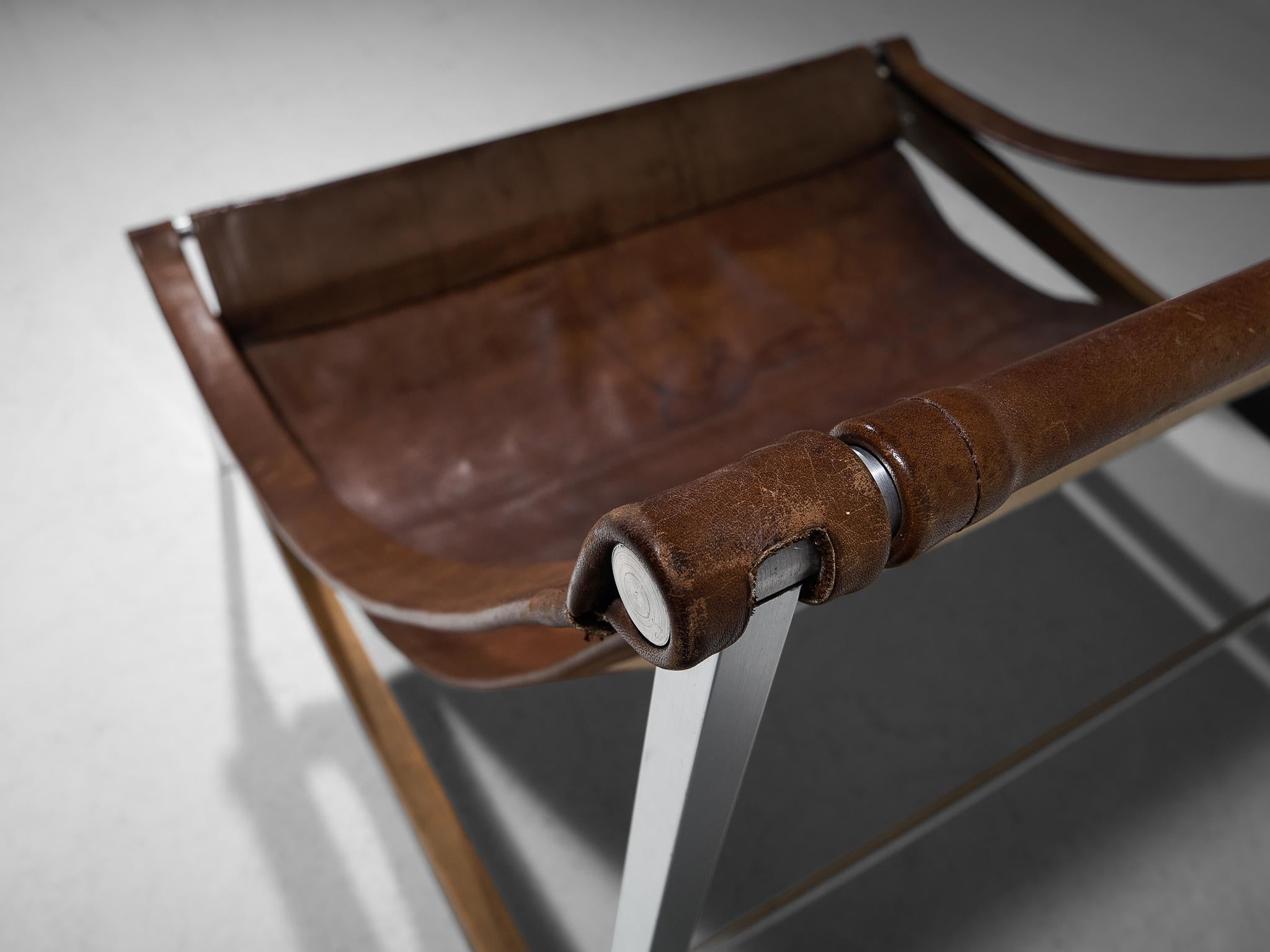 Danish Rare Stig Poulsson 'Bequem' Lounge Chair in Cognac Leather