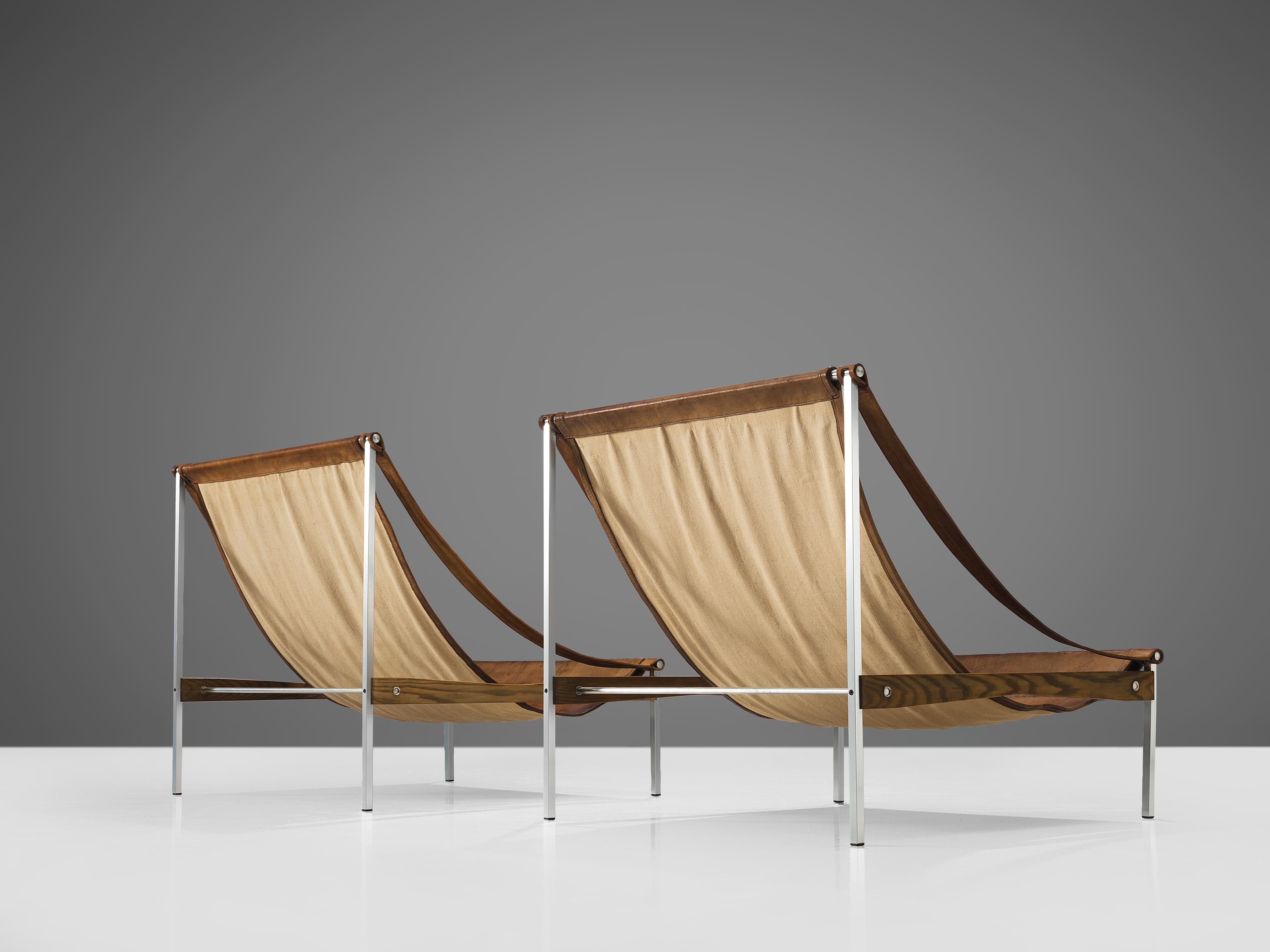 Steel Rare Pair of Stig Poulsson 'Bequem' Lounge Chairs in Cognac Leather