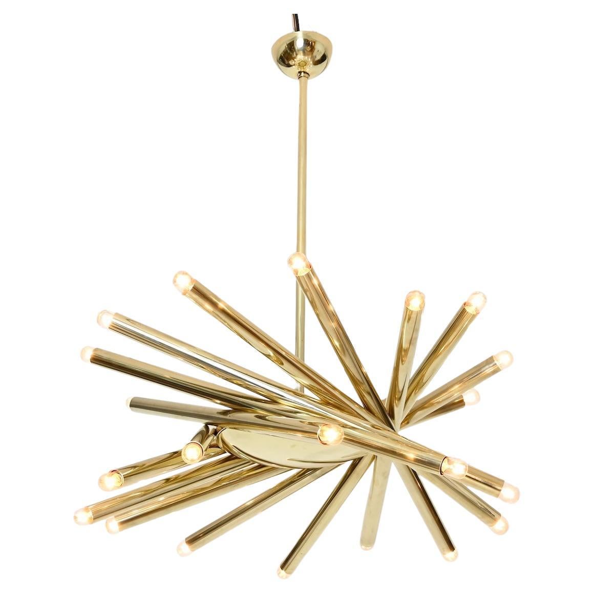 Impressive brass chandelier by Stilnovo, Milano Italy.

24 bulbs. 

Last picture shows smaller version of this fixture in Tamara Mellon's penthouse flat.