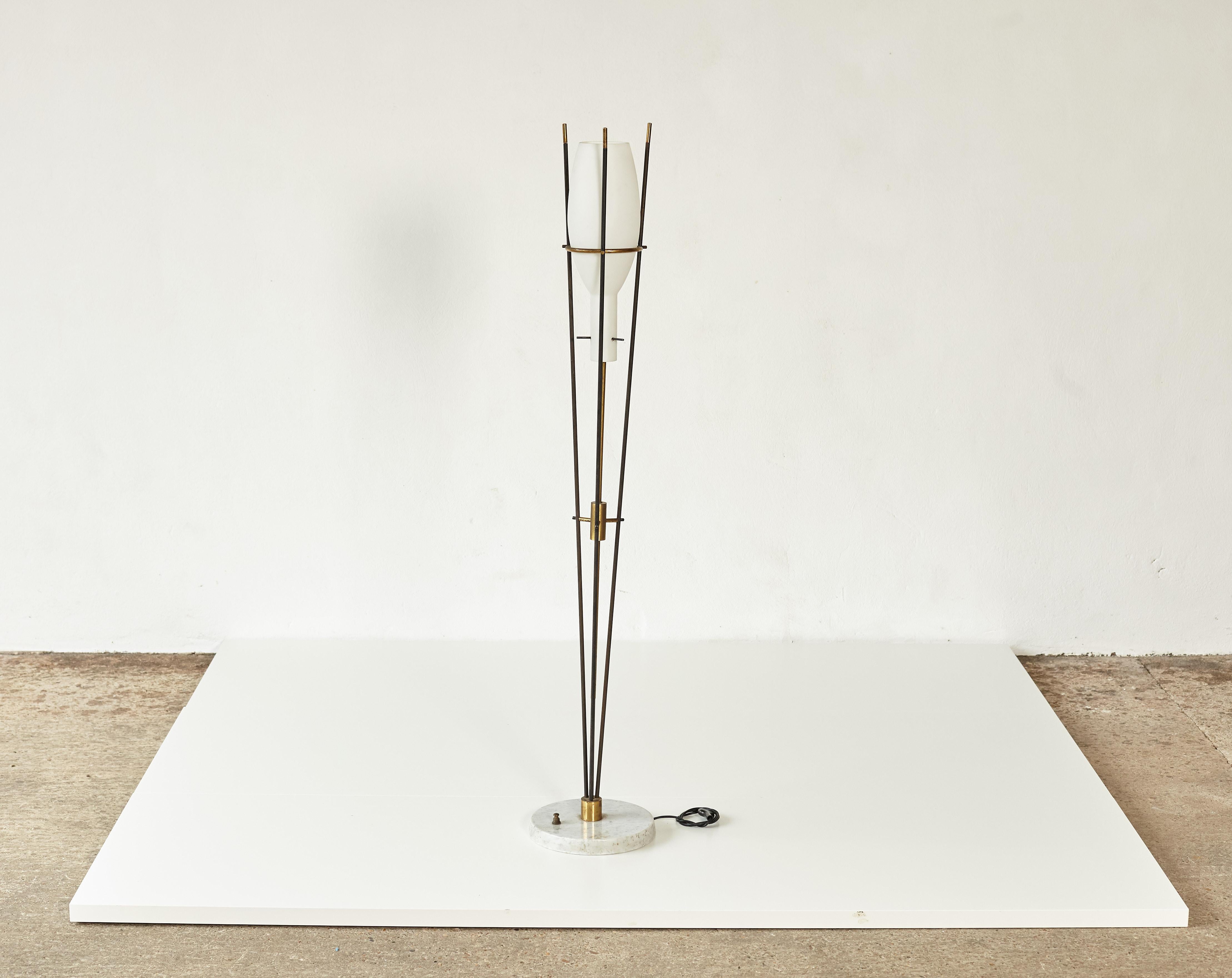 A very rare Stilnovo floor lamp from Italy in the 1950s. Marble base, brass and metal frame and opaline glass shade. In good original vintage condition. Local rewiring before use is recommended. Ships worldwide - please contact us directly for