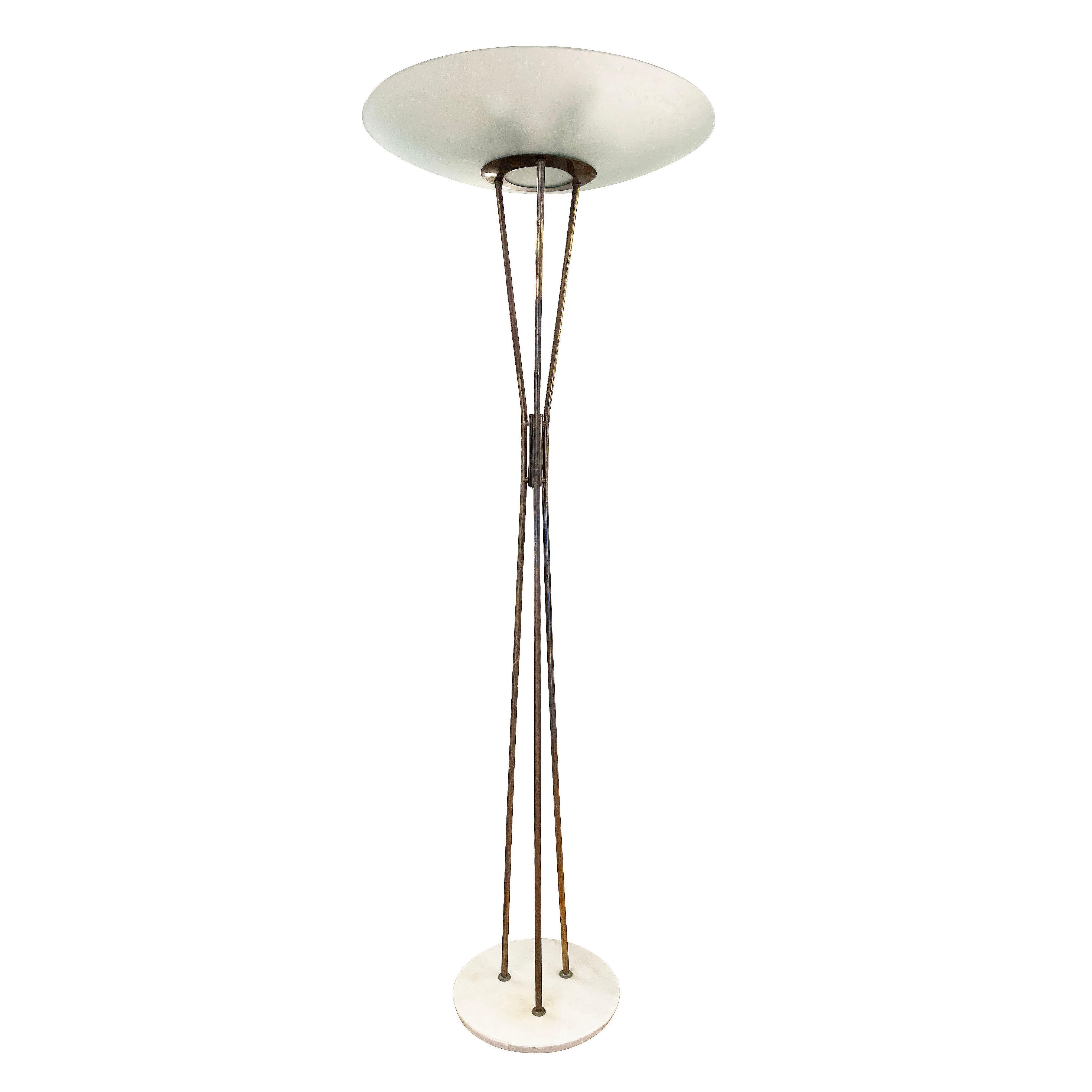 Rare Italian mid-century floor lamp by Stilnovo, marked with the original label. The hallmark of the piece is the textured glass shade concealing seven E26 base bulbs. The brass frame composed of three stems ends in a white marble