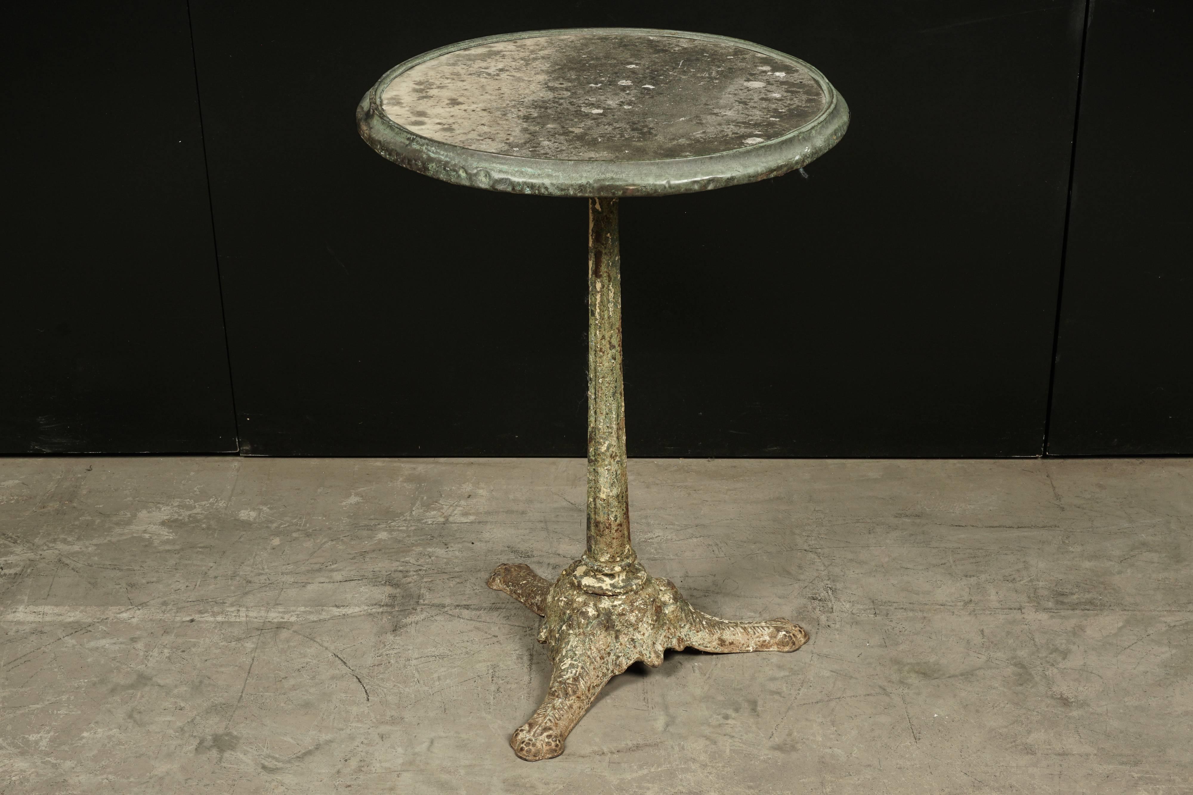 Rare stone top bistro table From France, circa 1920. Stone top with patina and original copper edge. Iron base with original color and surface.