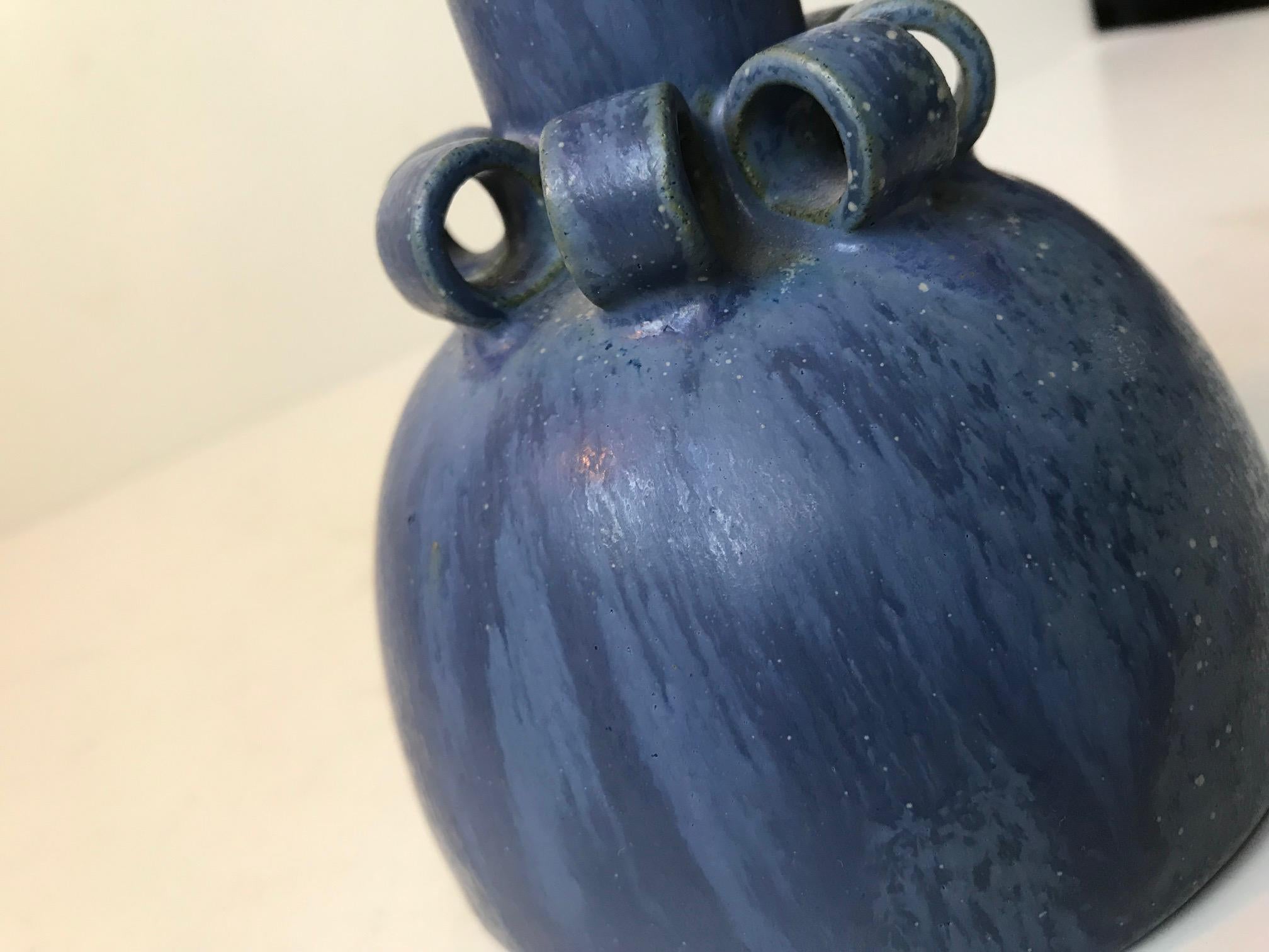 In one of the rarest designs by Arne Bang comes this Art Deco styled stoneware vase with hoops/rings and blue glaze. Its marked with AB initials and numbered 63. Very fine intact vintage condition.
