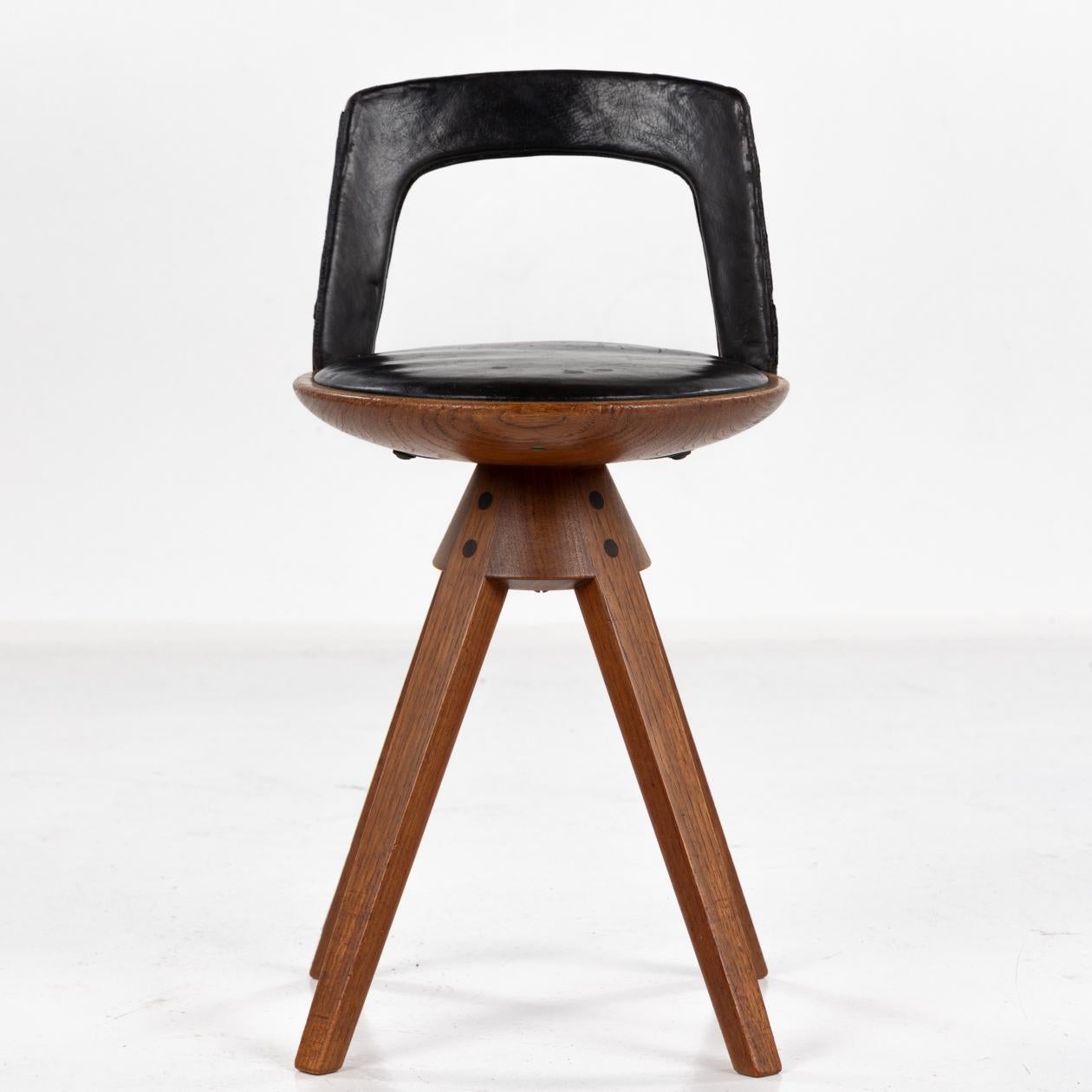Rare swivel stool in teak and original black leather. Designed in 1957. Plaquette from manufacturer. Designed by Tove & Edvard Kindt-Larsen, made by Thorald Madsen.