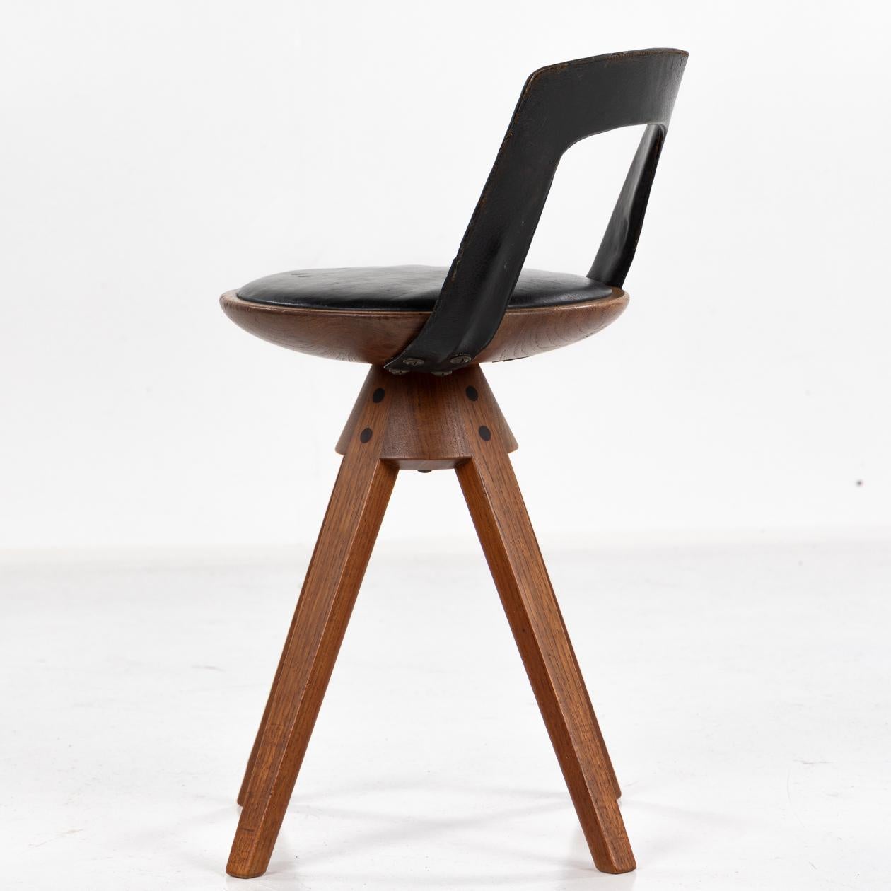 Danish Rare swivel stool in teak and original black leather by Kindt-Larsen For Sale