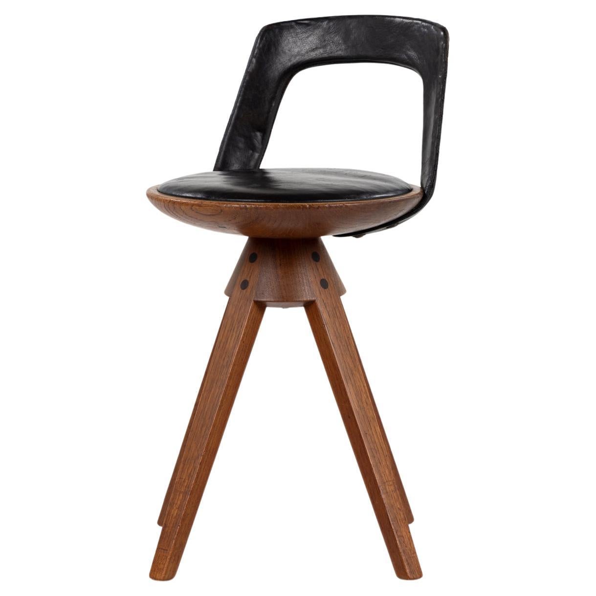 Rare swivel stool in teak and original black leather by Kindt-Larsen For Sale