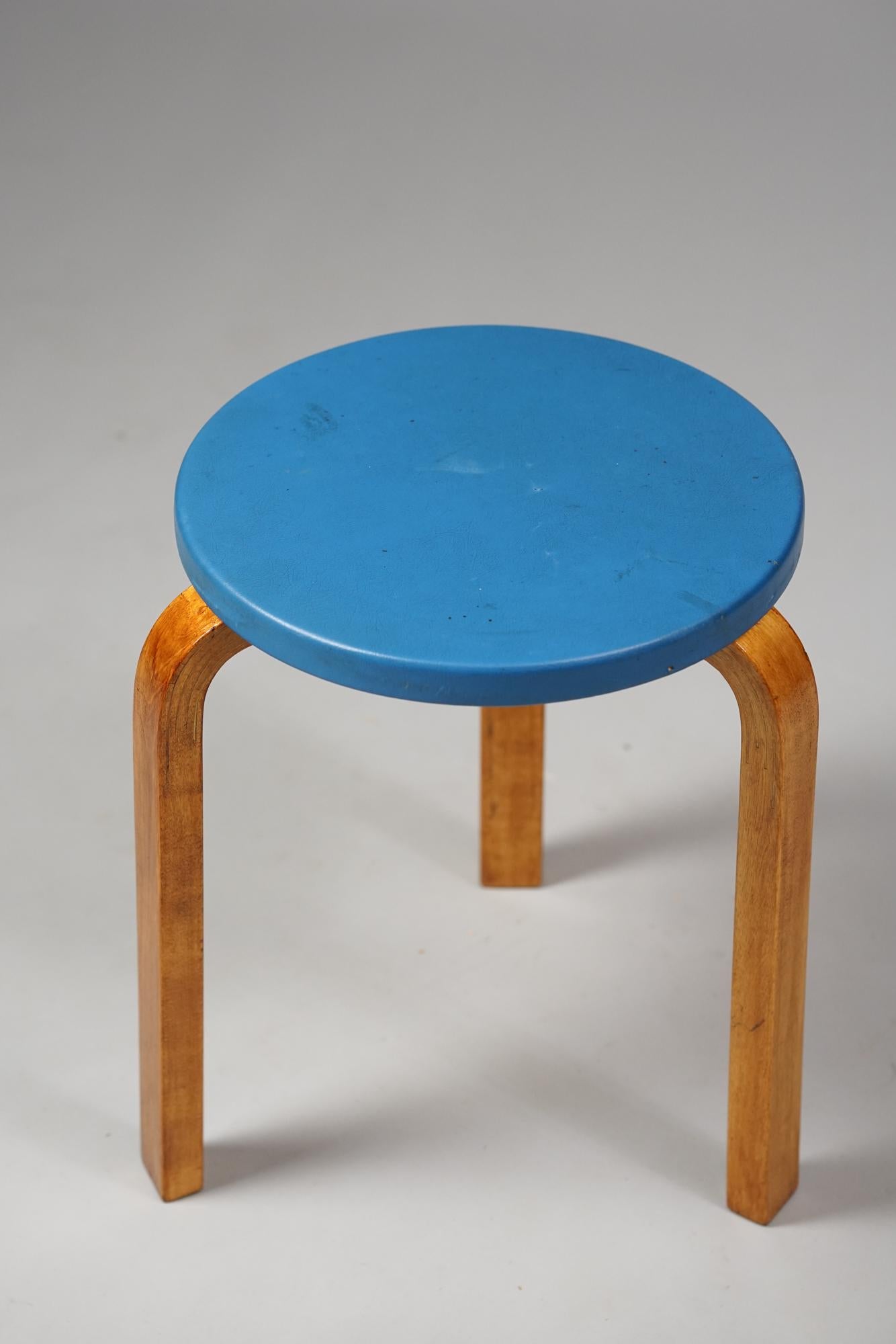 Stool model 60 by Alvar Aalto for Artek from the 1950s. Birch with rare color imitation leather. Good vintage condition, patina and wear consistent with age and use. Beautiful honey colored patina on the birch parts. Iconic Alvar Aalto design. 