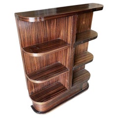 Raro estante para libros de madera de ébano Streamline Art Decó Tigre