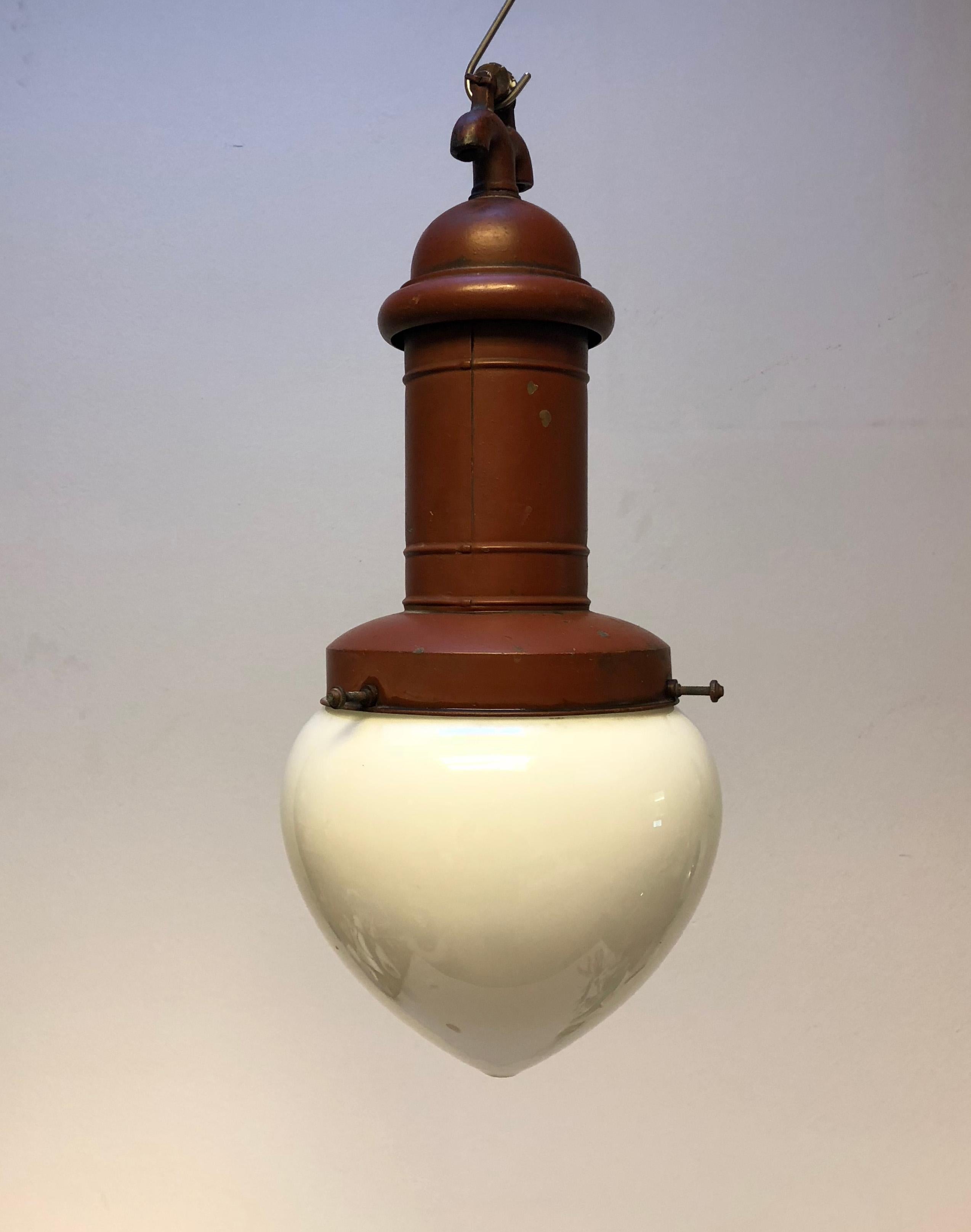 Ceiling pendant from the 1900s. Frame in brass, red-colored, with large opaline glass shade.
Dimensions ca: H 65 cm, D 25 cm.
Traces of wear commensurate with age, some scratches.
2 pieces awailable price/piece