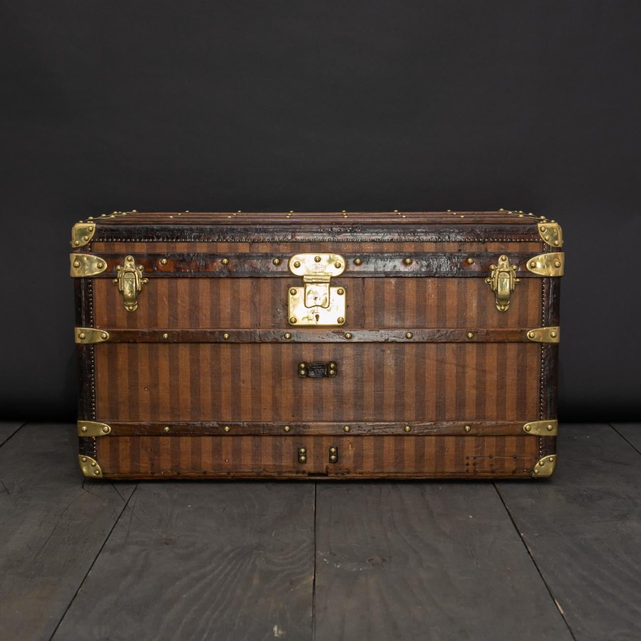 A rare Louis Vuitton striped canvas trunk with leather trim, brass fittings, single lock with key and re-lined interior to the lid, circa 1885.

Dimensions: 85 cm/33½ inches (length) x 49 cm/19¼ inches (depth) x 46 cm/18 inches (height).

Bentleys