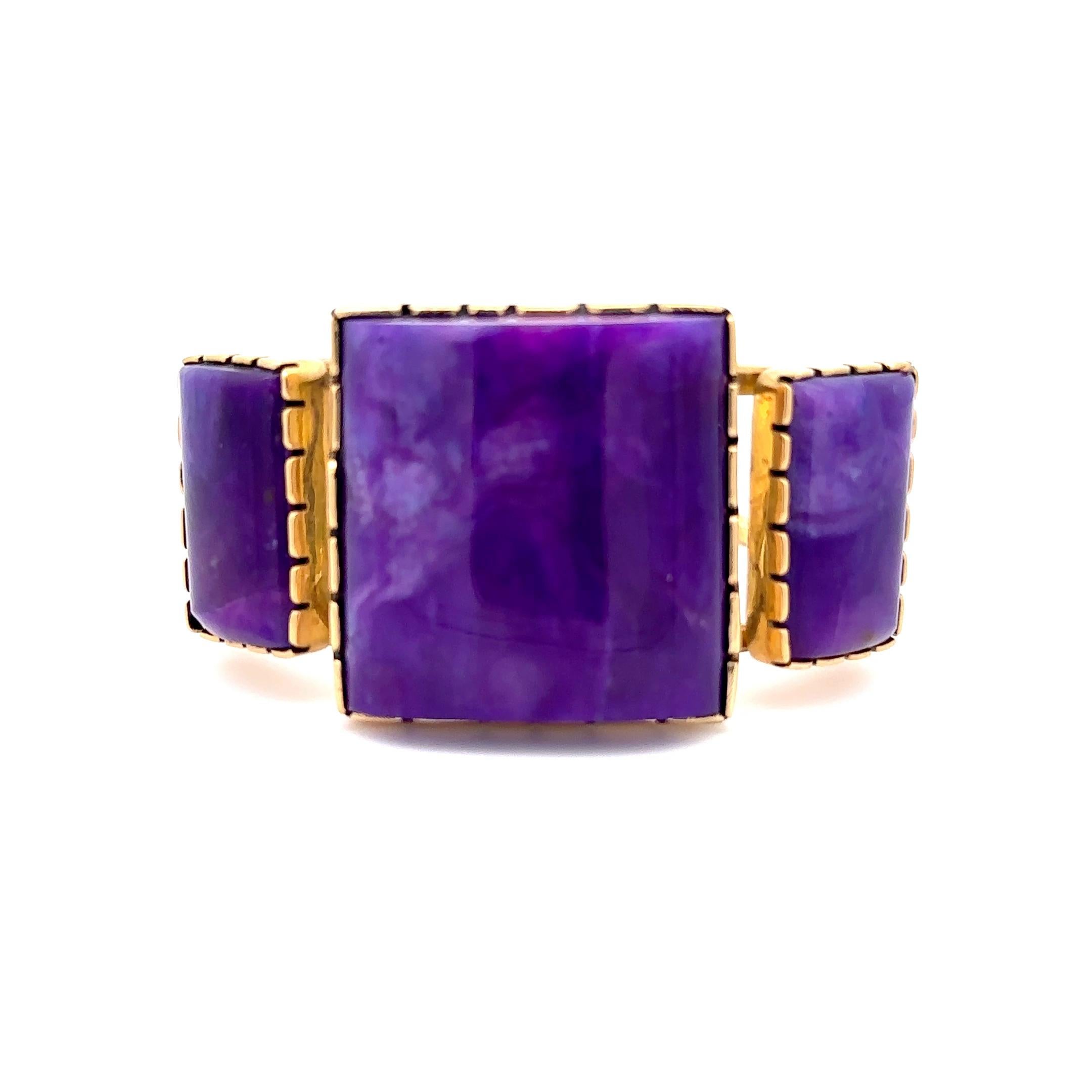 Introducing an extraordinary bracelet that will captivate your senses. Behold the sheer brilliance of this rare 18k yellow gold cuff, delicately set in sugilite—a true testament to Native American artist Noah Pfeiffer's exceptional craftsmanship.