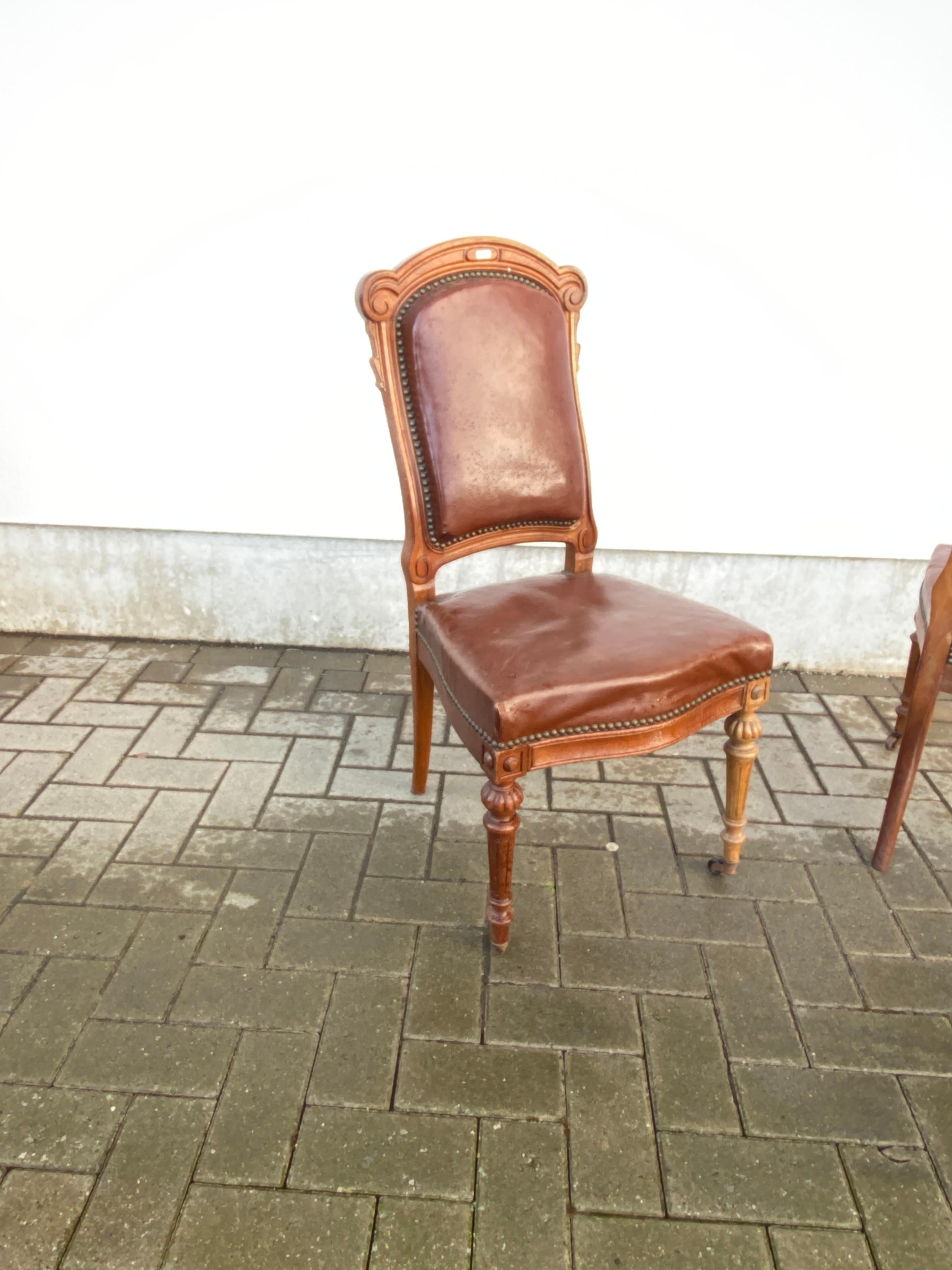 19th Century Rare suite of 12 Louis Philipe period chairs in oak and leather, 19th century  For Sale