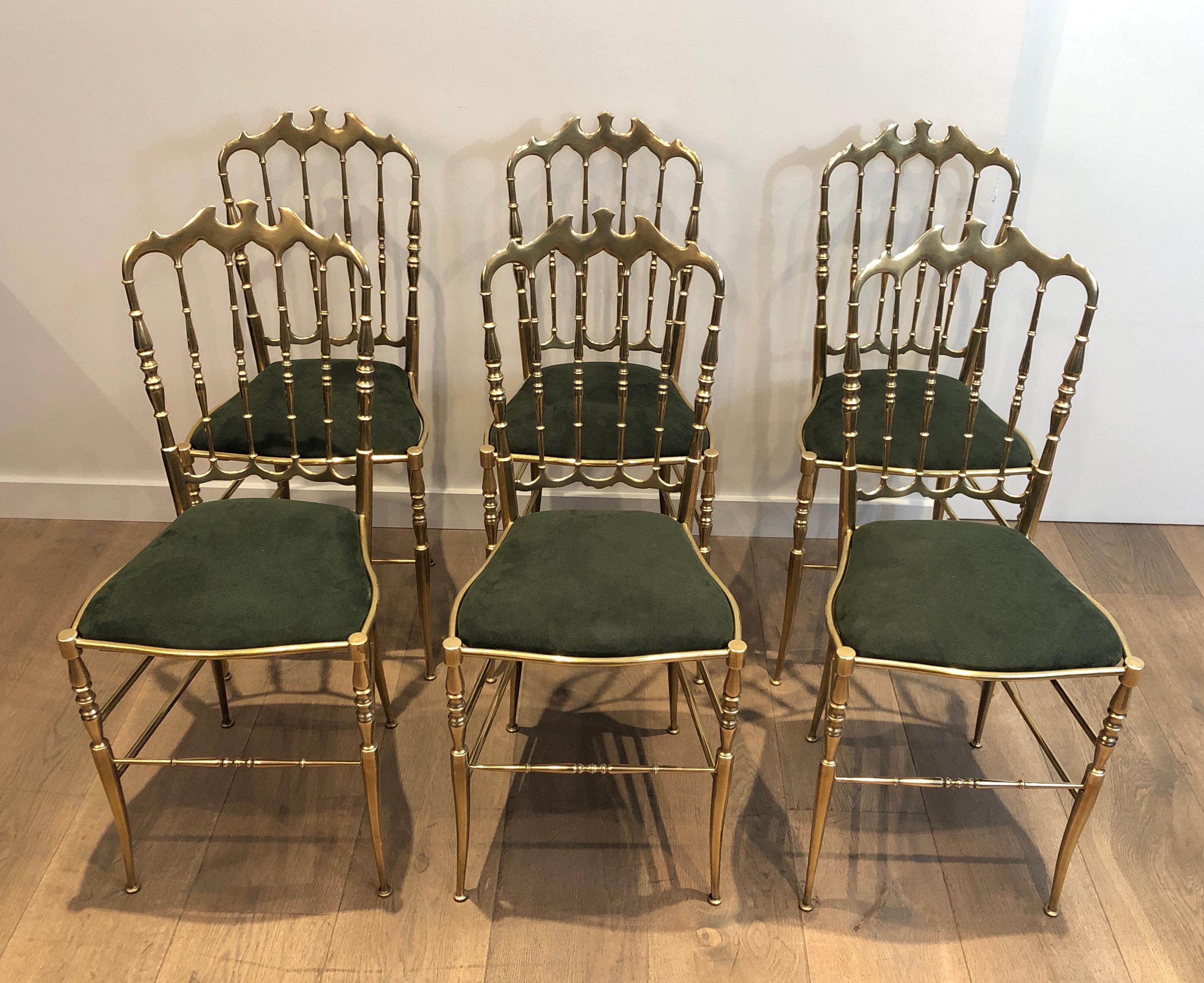 This rare suit of 6 beautifully crafted brass Chiavari chairs have seats covered in a chic green velvet. The chairs are heavy and strong and made of very good quality. This is an Italian work. Circa 1940.