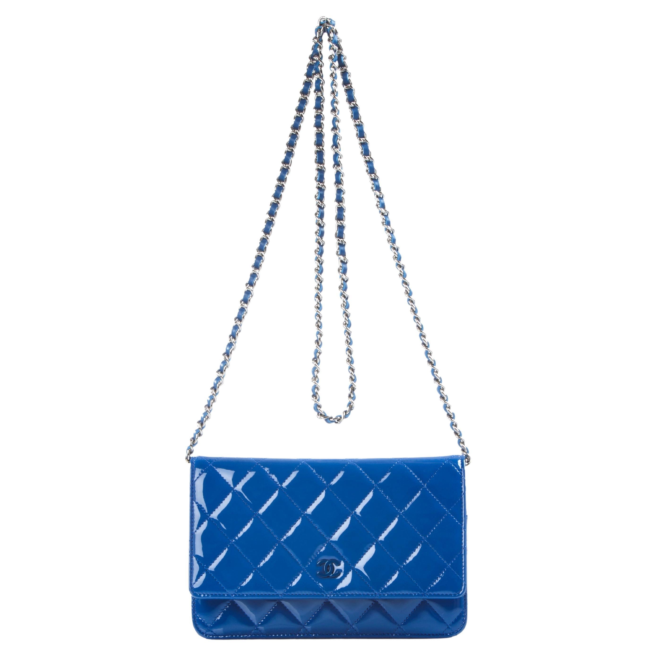 Chanel Rare Royal Blue Patent Leather WOC Crossbody Pristine

Year: 2014  
So blue plated hardware
Interior zippered pocket on flap
Interior 6 card slot
Interior large centered zipper pocket
Additional large interior pocket
Blue lambskin