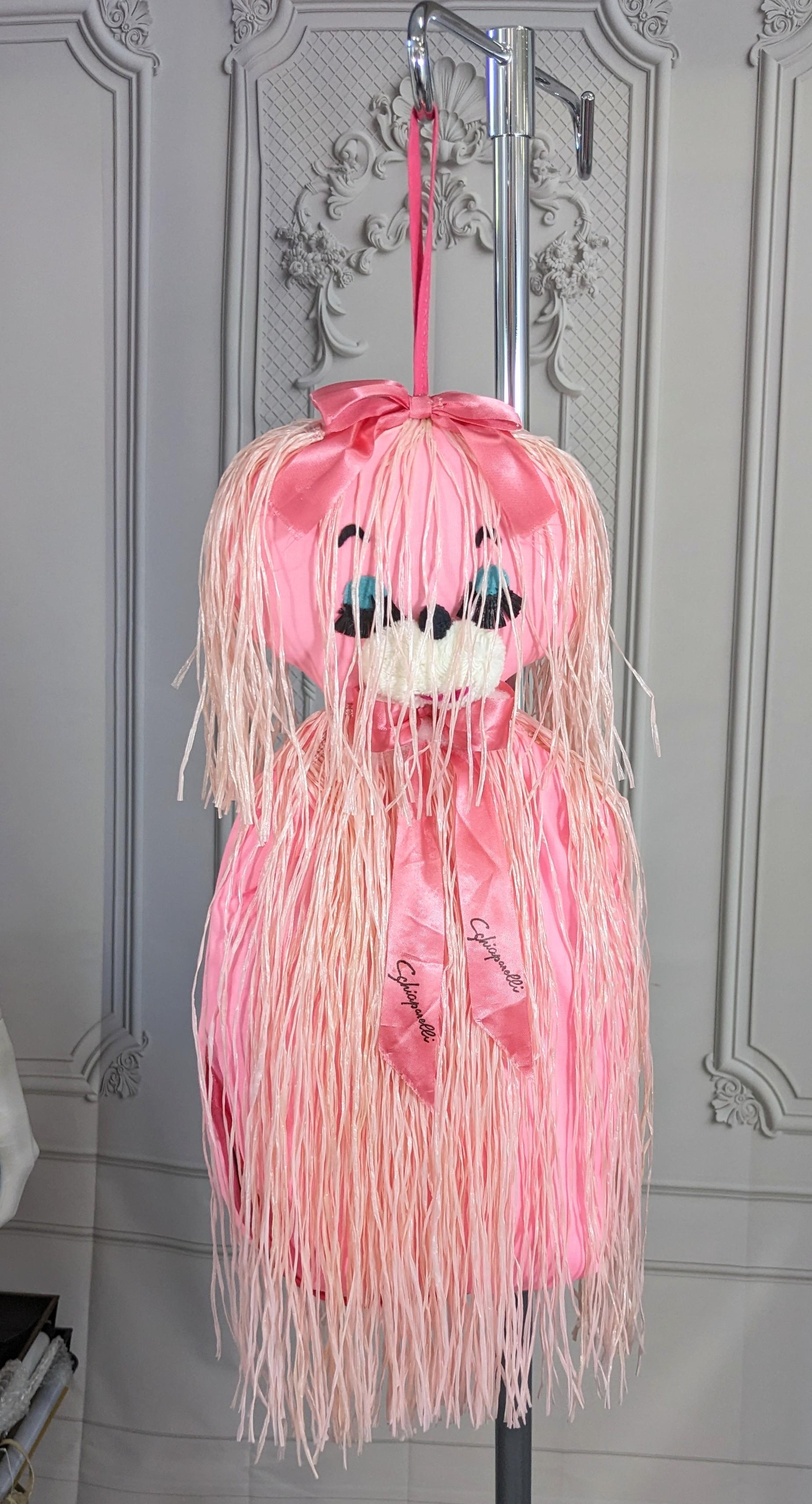 Rare and unusual figural Surrealist Elsa Schiaparelli lingerie bag. This amusing, rare Schiaparelli figural cat lingerie bag is made of bright pink acetate, with 