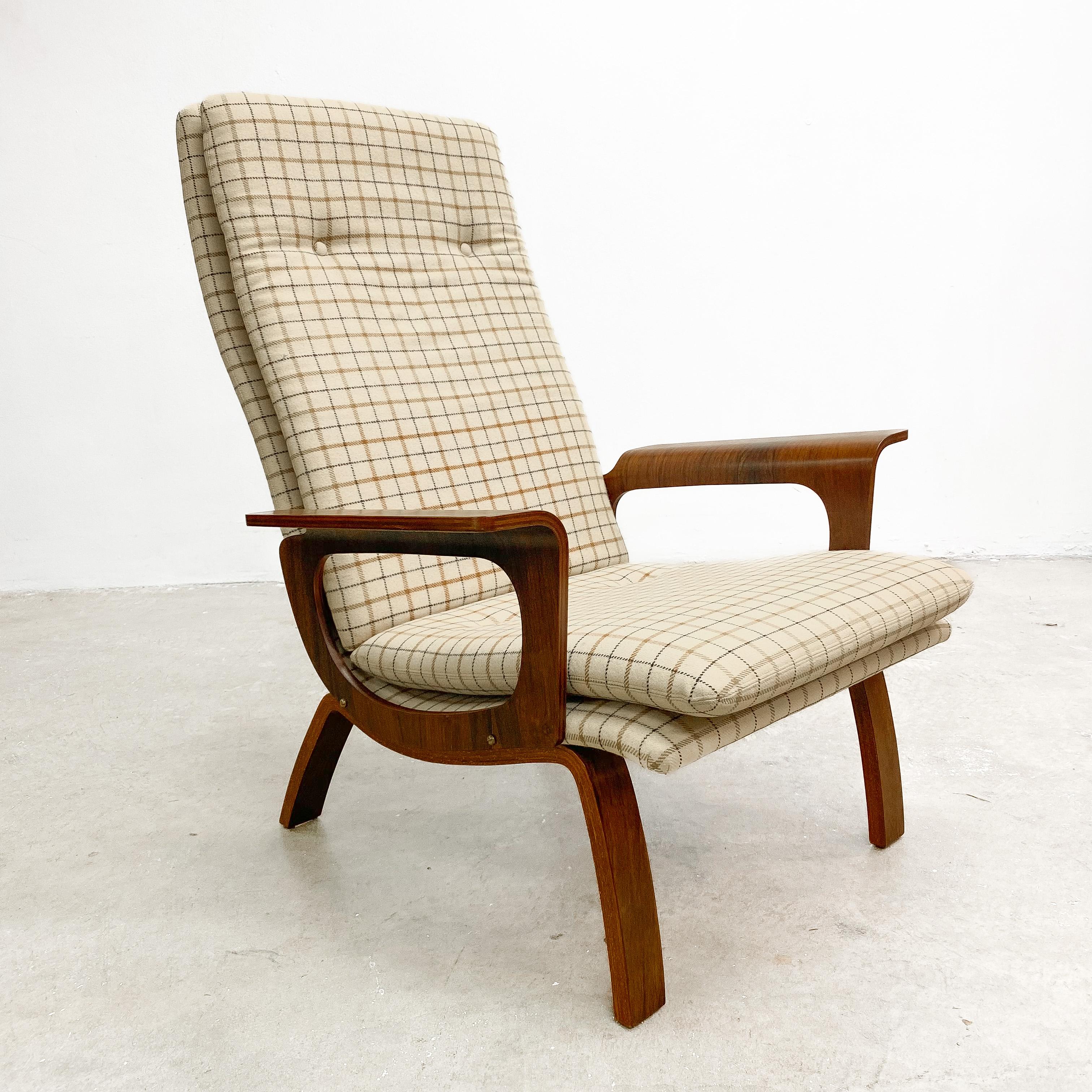 This unique and rare armchair showcases the beauty of Brazilian rosewood and bent plywood. A great example of Scandinavian mid century modern design . 

Original wool upholstery in good condition. The frame has been professionally restored and