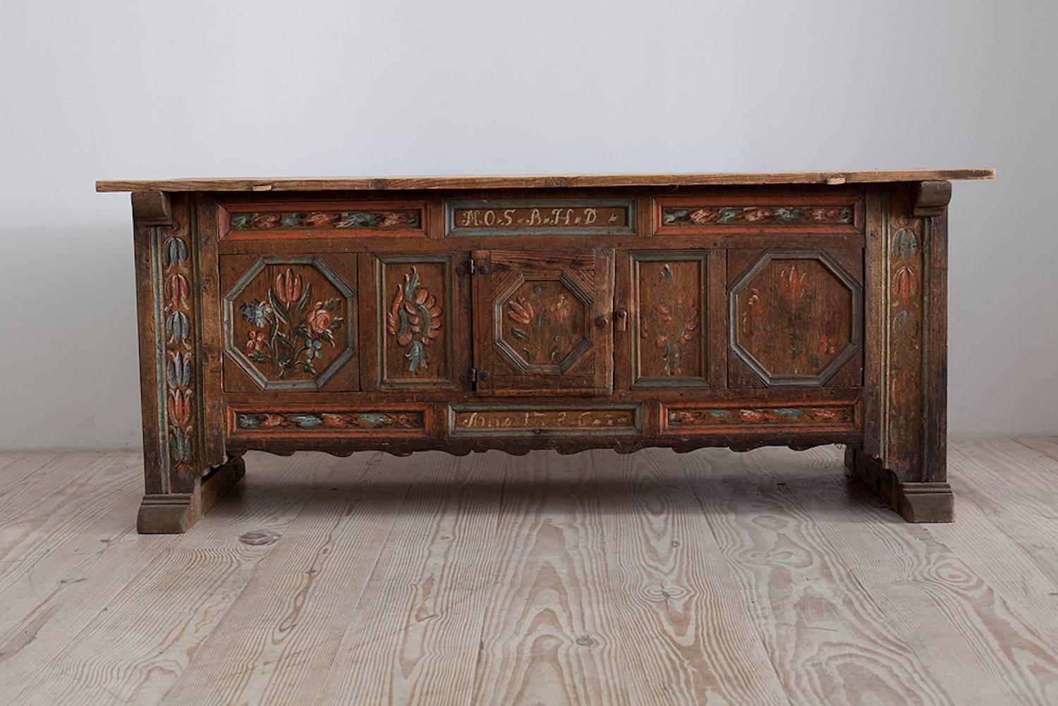 Rare 18th century Swedish sideboard with center door, kistbord med dörr, inscribed and dated: M.O.S / B.H.D. / Anno 1786, original paint, origin: Skåne, Sweden.

Rarely seen for sale, these sideboards, historically, would be located in the Manor