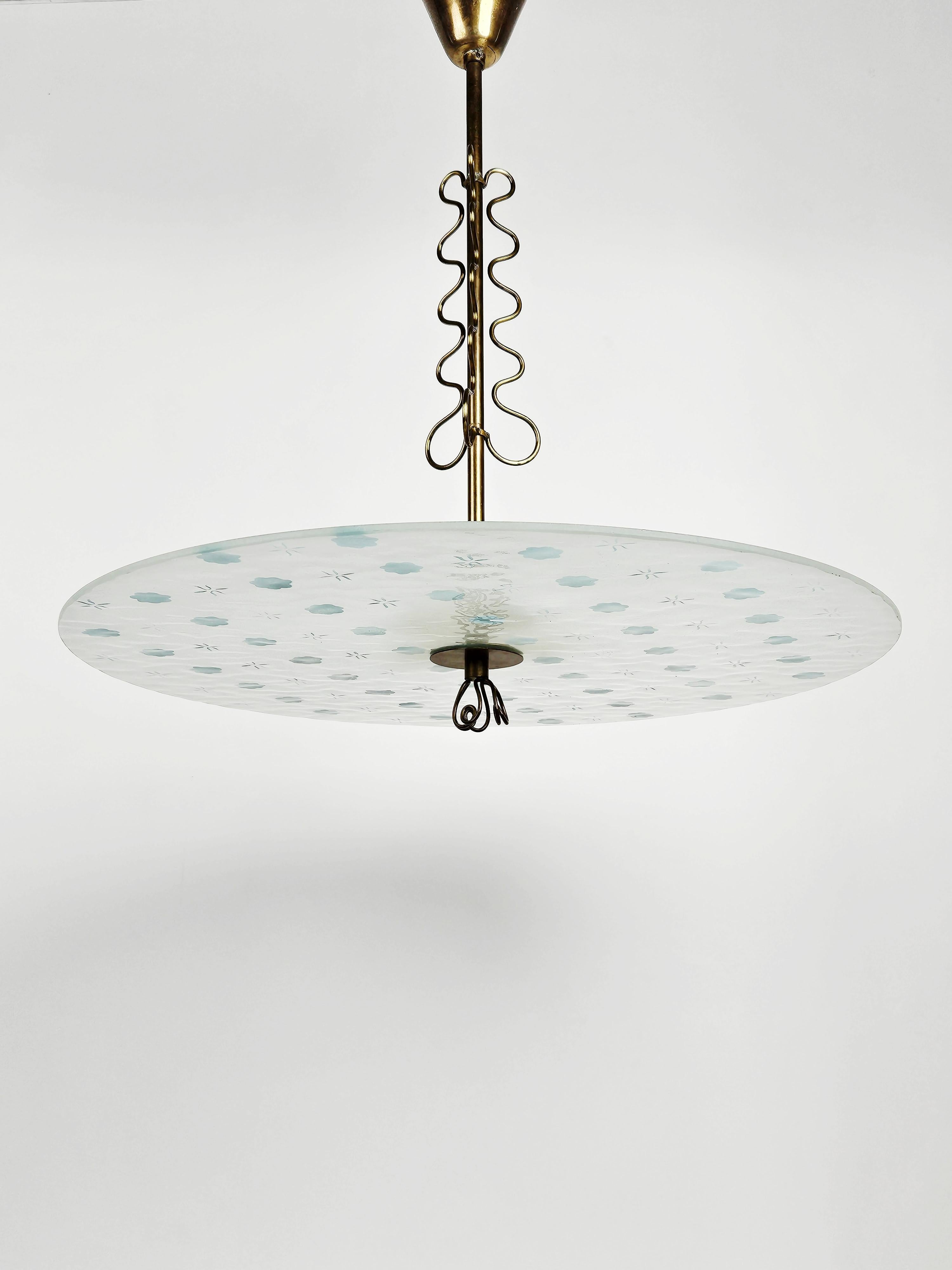 Rare and elegant ceiling lamp in the style Swedish Modern from the middle of the 20th century. 

Made with beautiful brass details, frosted glass disc with a light blue flower decor. 