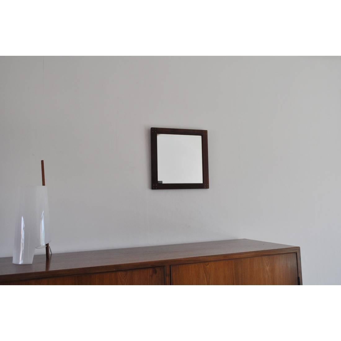 Rare Swedish rosewood mirror with silver detail by Uno & Östen Kristiansson. Produced by Luxus in Vittsjö, 1960s.
 