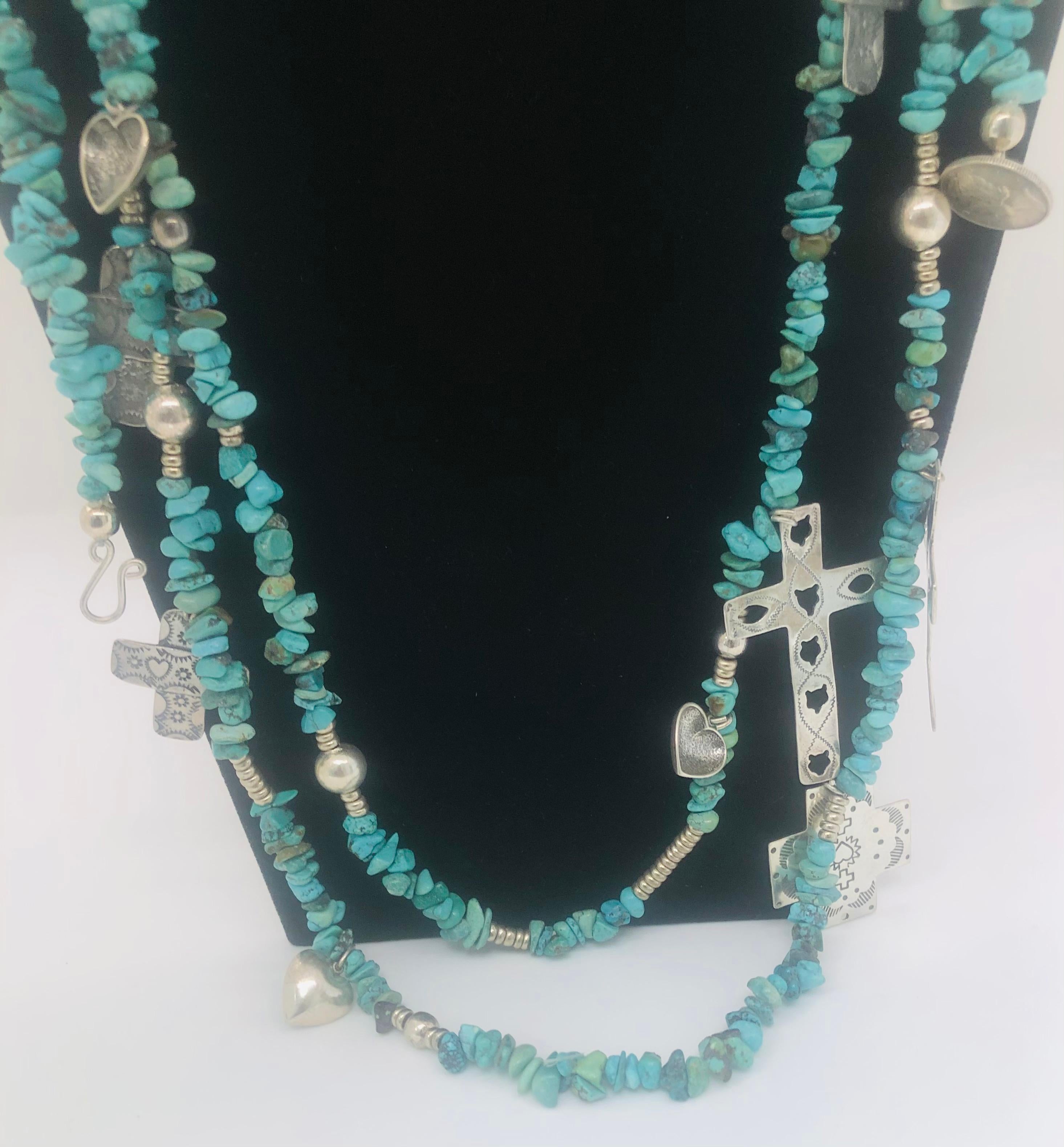 A rare T Foree necklace with antique sterling silver cross pendants & Navajo turquoise. The statement necklace is engraved and marked T Foree sterling 0.925 on the pendants. The pendants vary in size, design and shape. 

Maker/ Artist: T Foree