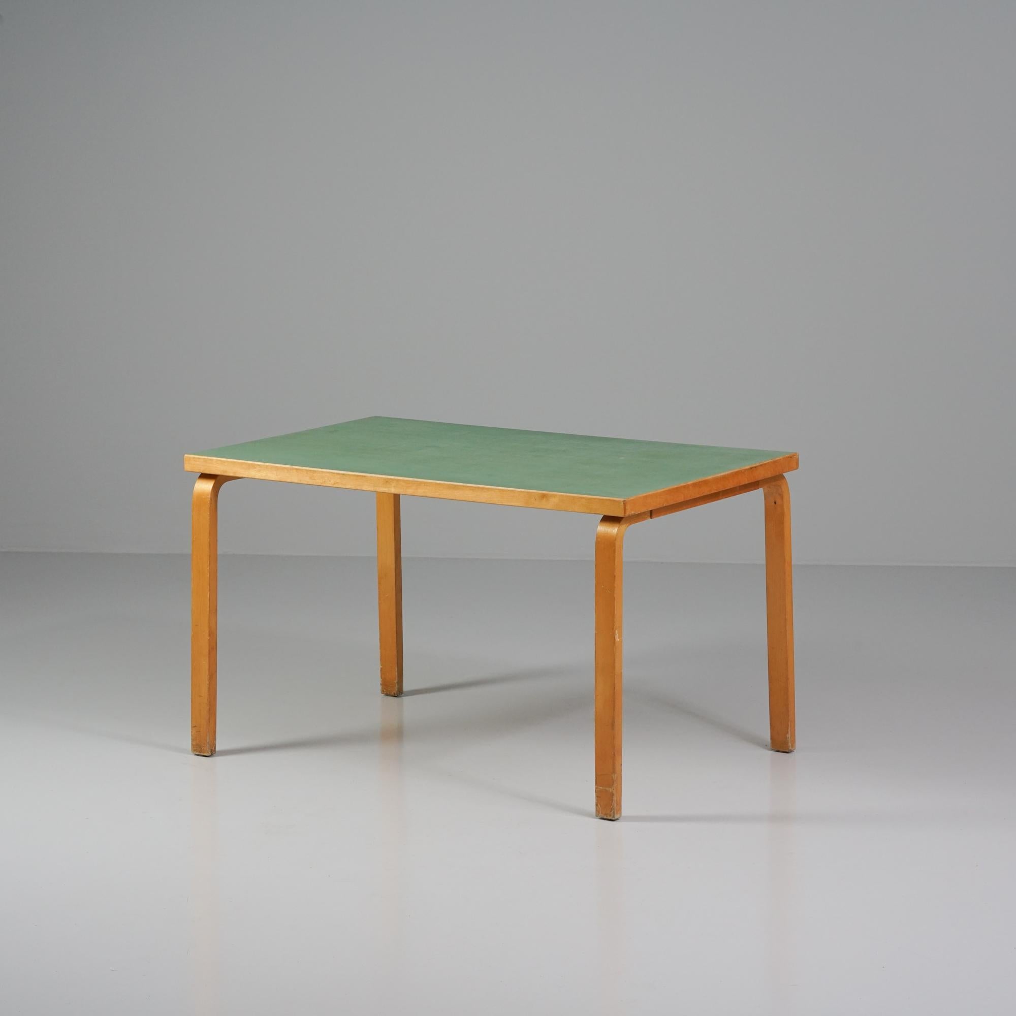 Rare table, designed by Alvar Aalto, manufactured by Oy Huonekalu- ja Rakennustyötehdas Ab, 1940/1950s. Birch frame, rare green colored linoleum. Good vintage condition, patina and wear consistent with age and use. 

Alvar Aalto (1898-1976) is