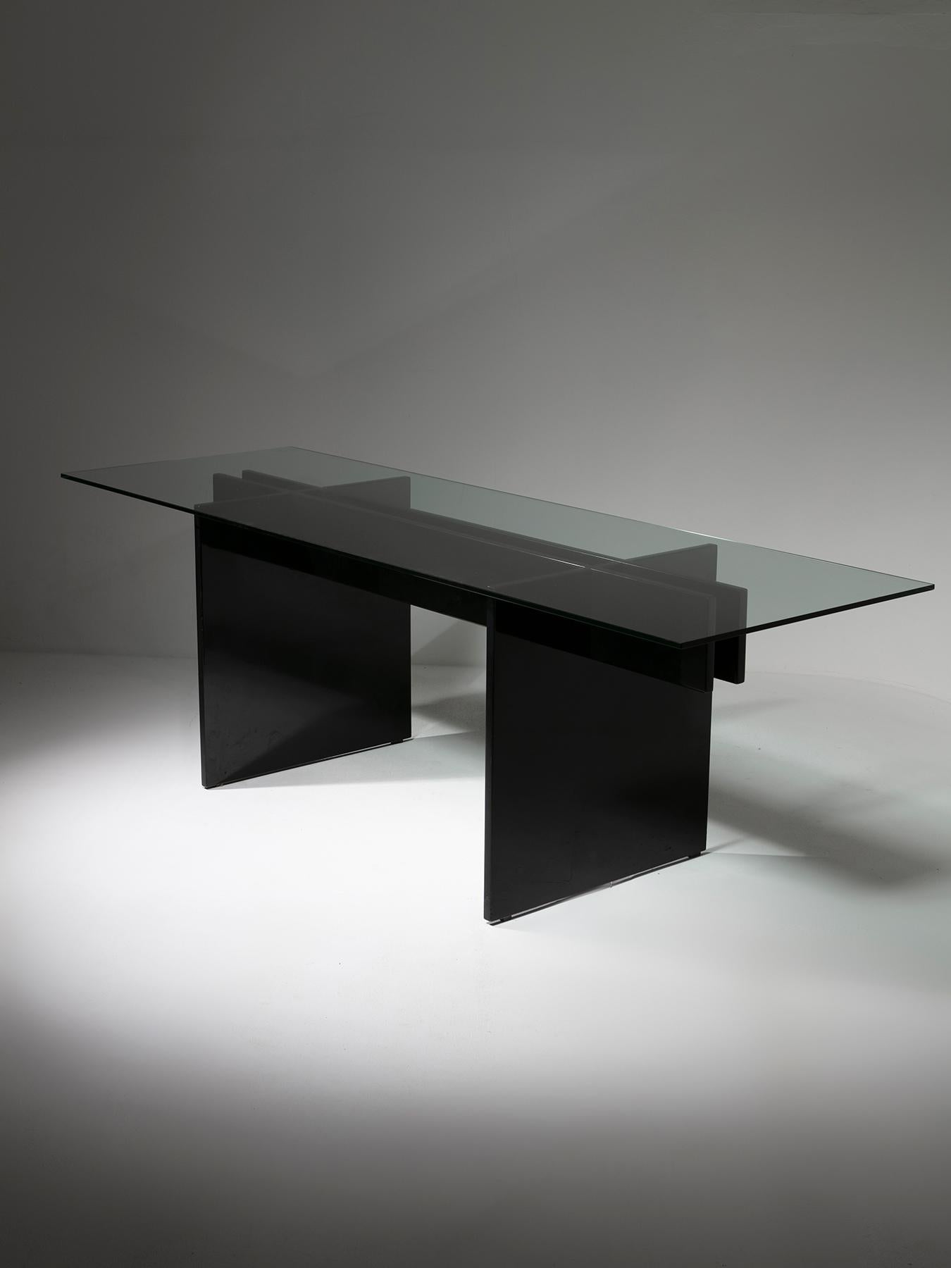 Large table by Studio Tetrach for Bazzani.
Black lacquered straight frame supports a thick crystal top.