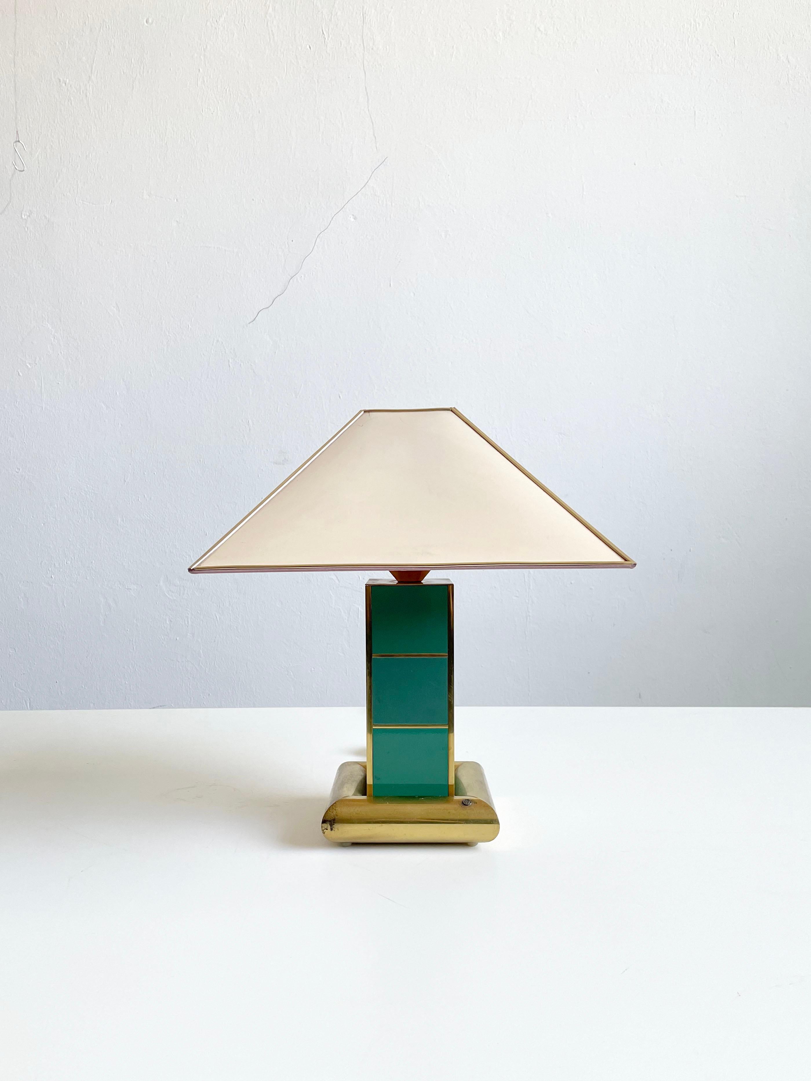 Rare and very decorative table lamp manufactured by AV Vikic, Croatia 1980's
Hollywood regency style reminiscent of art deco design

The lamp is made of brass painted base, with geometrical central structure decorated with beautiful turquoise