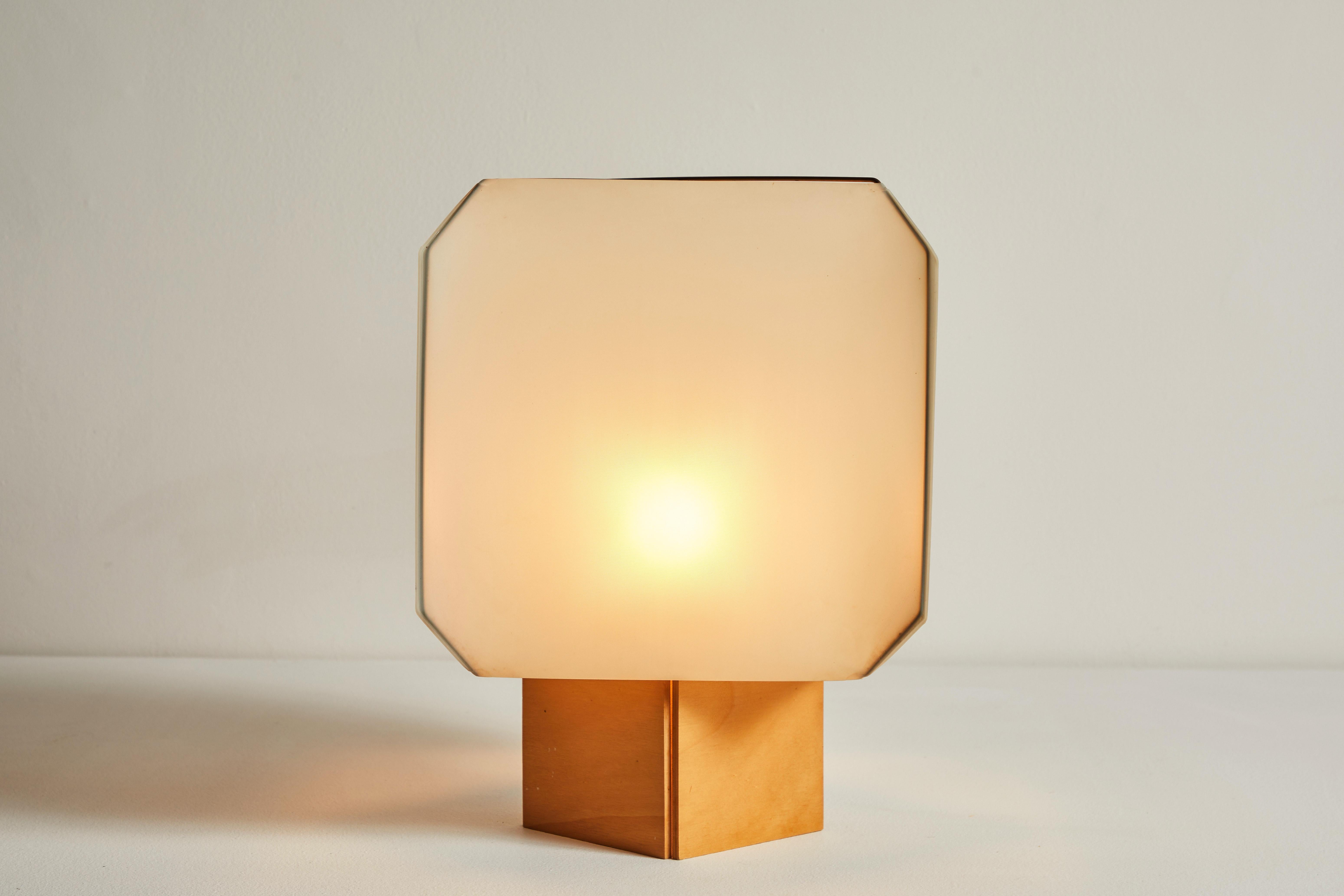 Bali Table Lamp by Bruno Munari for Danese. Designed and manufactured in Italy, 1958. Fabric and wood base. Original cord. We recommend one E27 60w maximum bulb. Bulbs provided as a one time courtesy.  We have two of these table lamps available