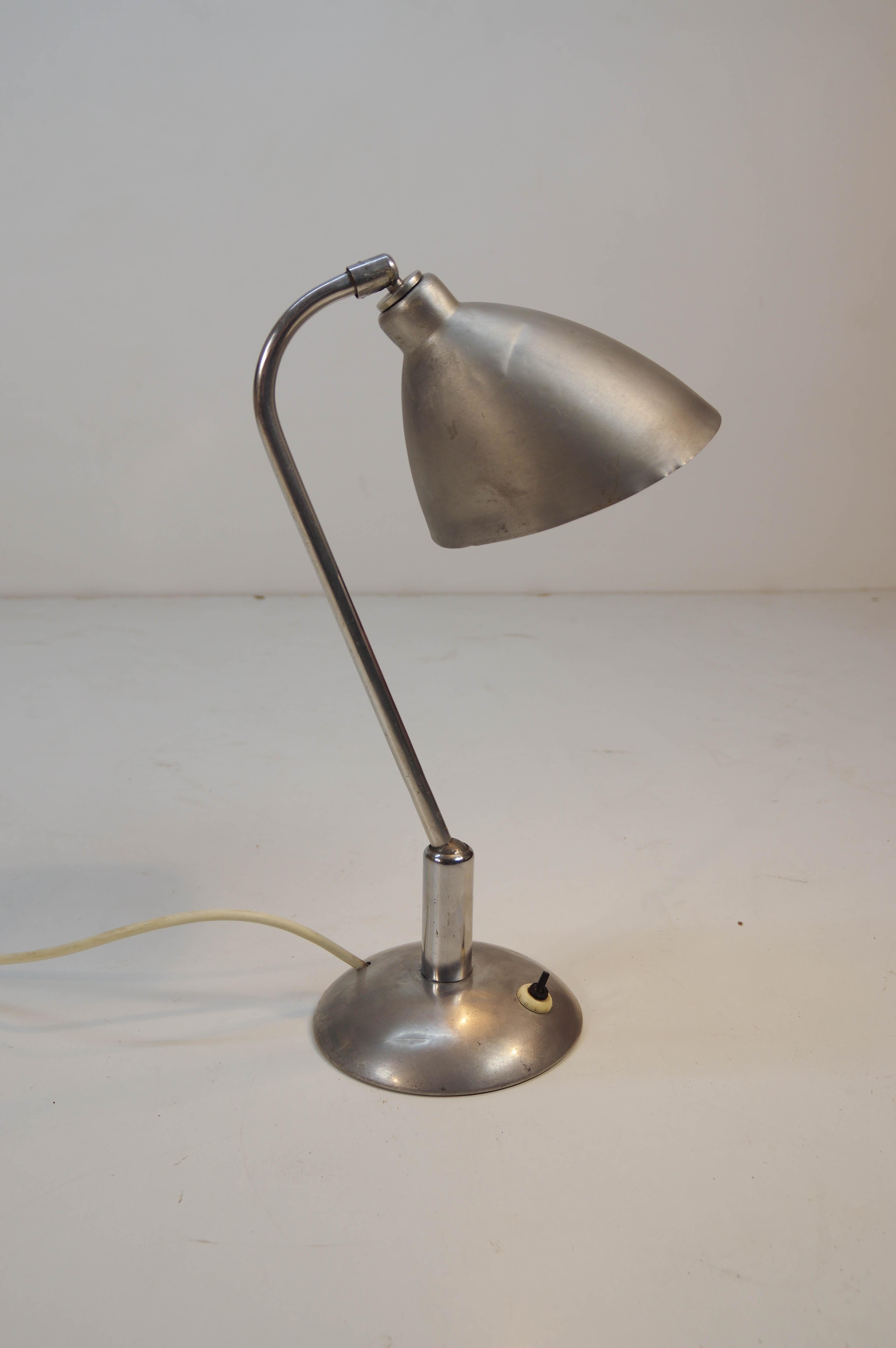Iconic aluminum adjustable table lamp by Franta Anyz. Unique type of joint invented by Anyz. Original condition - some defects on a shade. 1x40W, E25 or E26 or E27 bulb.