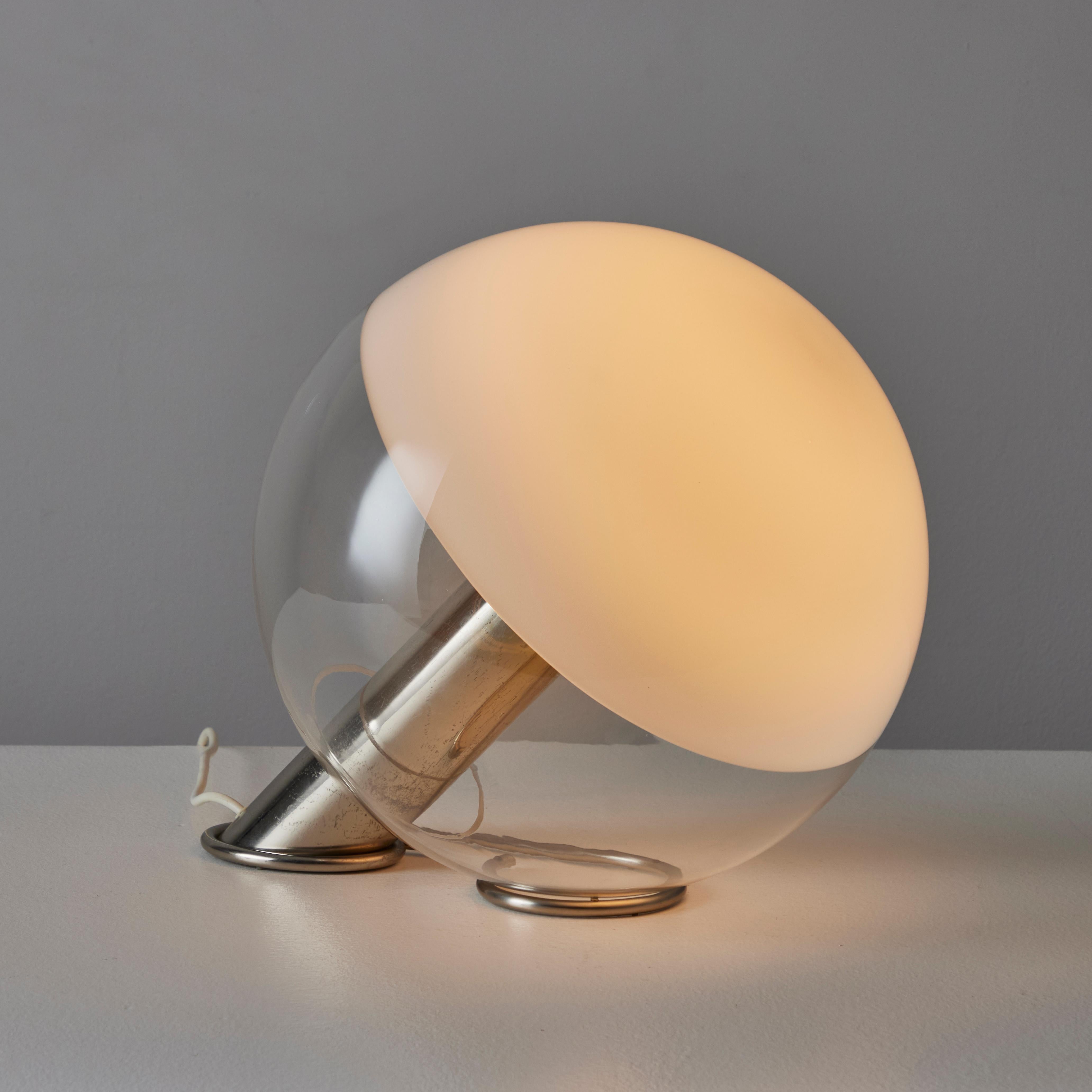 Rare Table Lamp by Guidetti Crippa for Lumi. Designed and manufactured in Italy, circa the 1970s. A gorgeous clear glass globe with a white-dipped top end, is cradled onto a polished nickel base. The base has a dimmer switch and orignal european