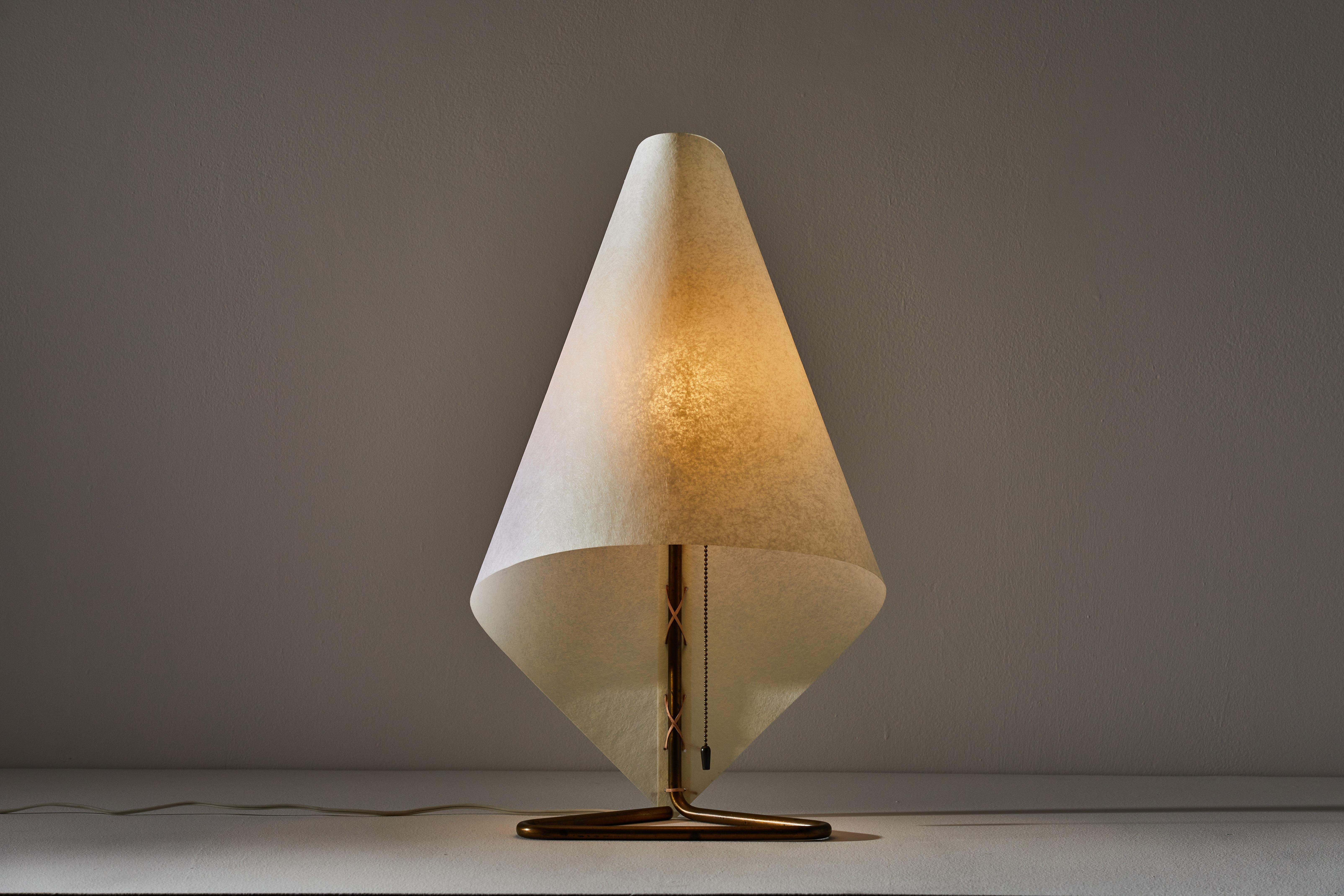 Rare and important table lamp by Henry P. Glass. Manufactured in the U.S., circa 1940s. Folded parchment shade, brass base. Rewired with new cord. One of two examples that he designed for his personal residence. These lights were never put into