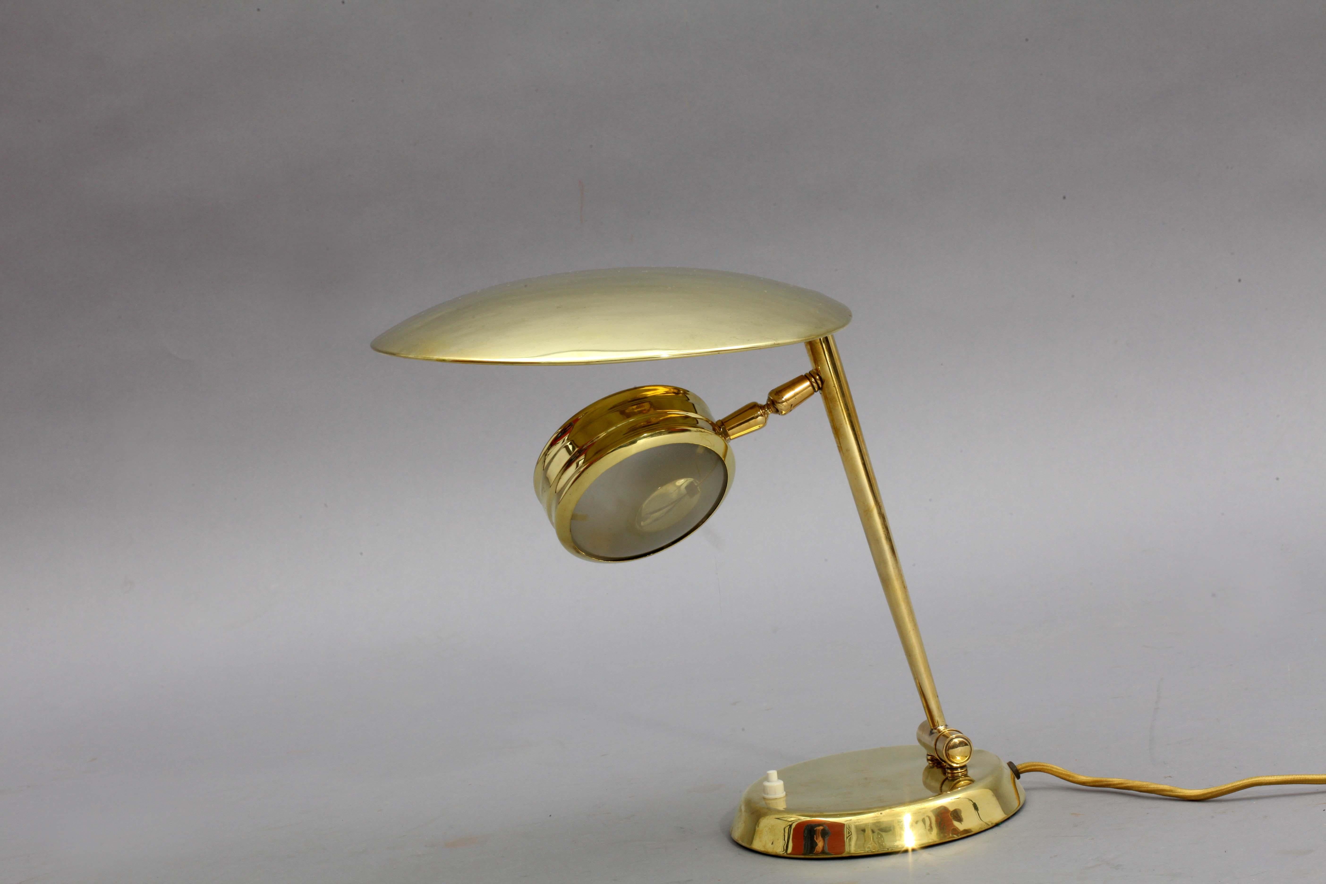 Rare table lamp
Lumen, Italy, 1950
brass,
movable glass reflector.