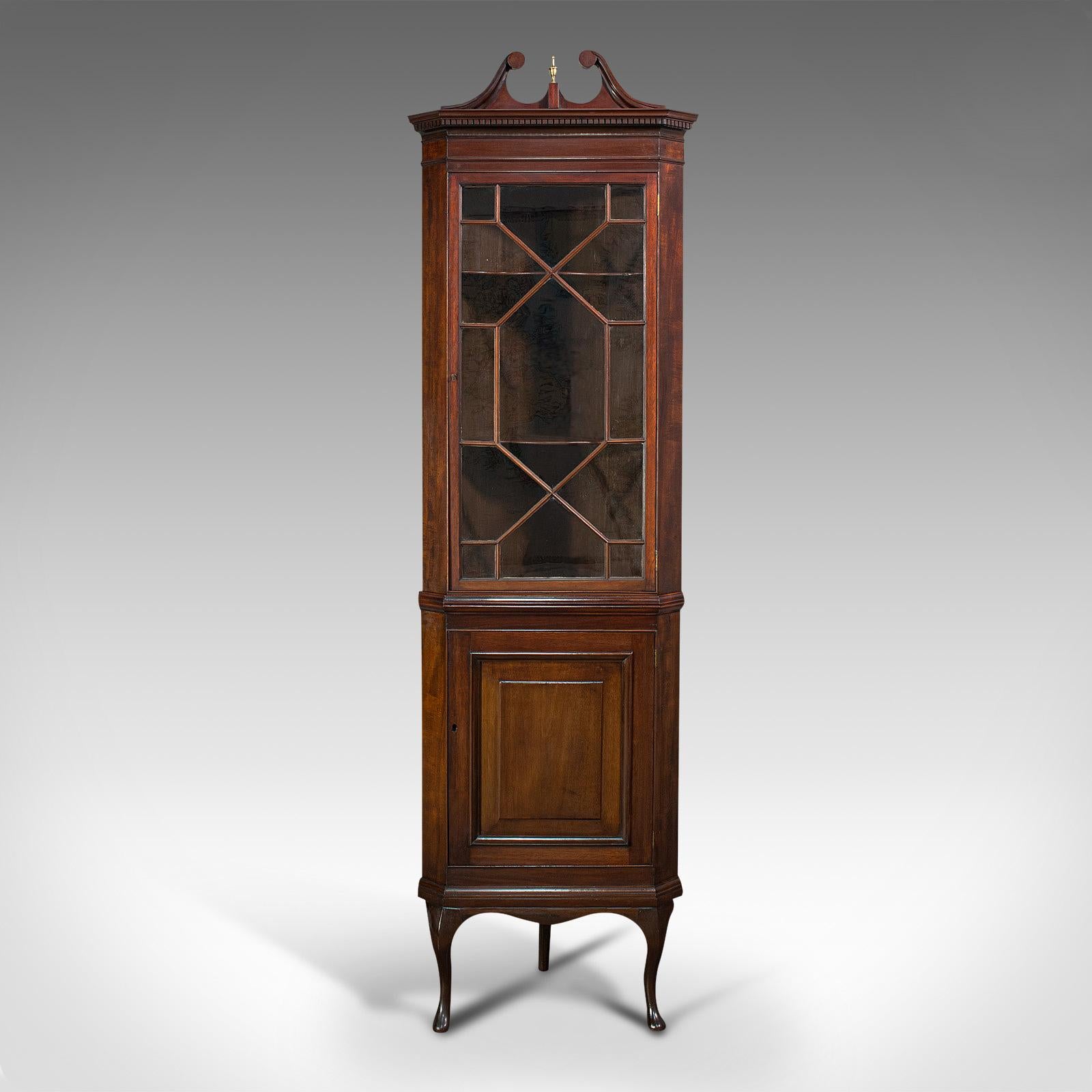 This is a rare, tall antique corner cabinet. An English, mahogany display cupboard on base in Georgian revival taste, dating to the Victorian period, circa 1880.

Impressive and of room height at 7'
Displaying a desirable aged patina, in very