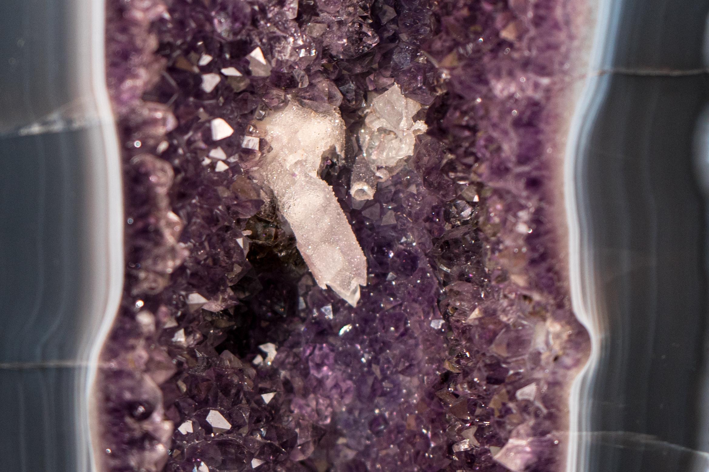 Gorgeous Tall Blue Banded Agate Geode with Sparkly Amethyst and Calcite Inclusions 

▫️ Description

Breathtaking and beautiful, this Lace Agate with Amethyst Geode features spectacular blue-banded agate lines on a rare, slim, stunning aesthetic