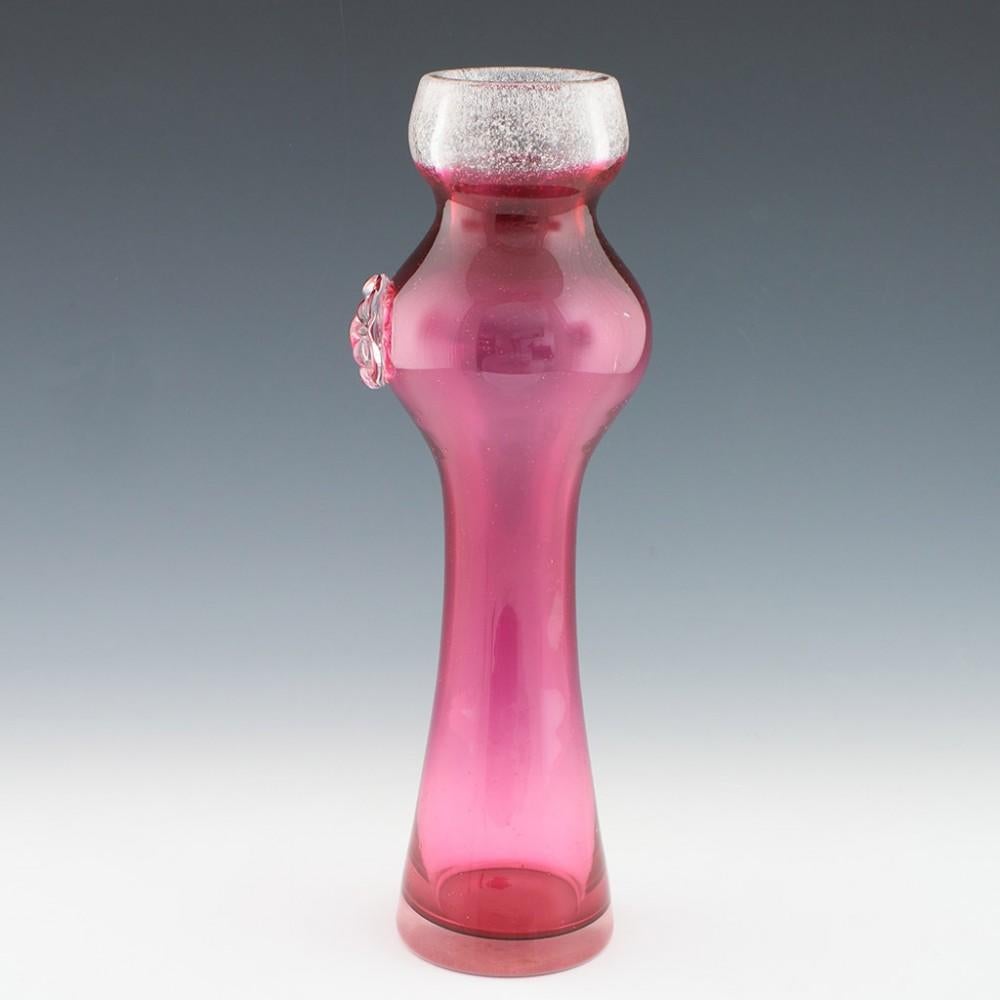 Heading : Rare tall rose vase probably designed by Josef Hospodka for Chribska glass
Date : c1965
Origin : Probably Chribska, Czechoslovakia
Bowl Features : Rose colored glass with applied prunt and mica frit
Type : Lead
Size : 32.9cm height, 10.4cm