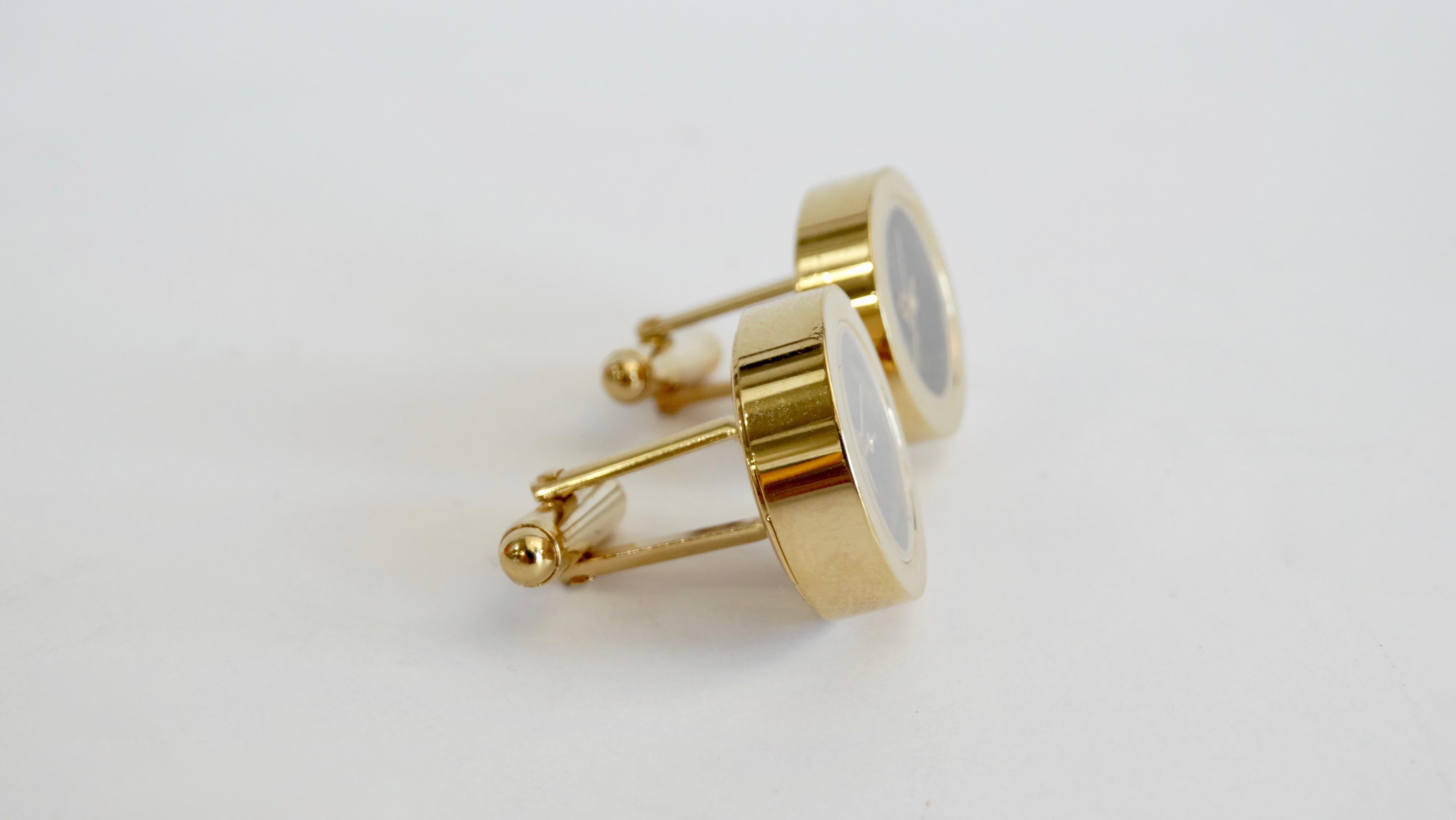Make a subtle statement with these amazing Tateossian cufflinks! Circa late 90s/ early 2000s, these more rare cufflinks are made of gold plated stainless steel. The clock features a black dial, gold number markers, and manual wind. The perfect