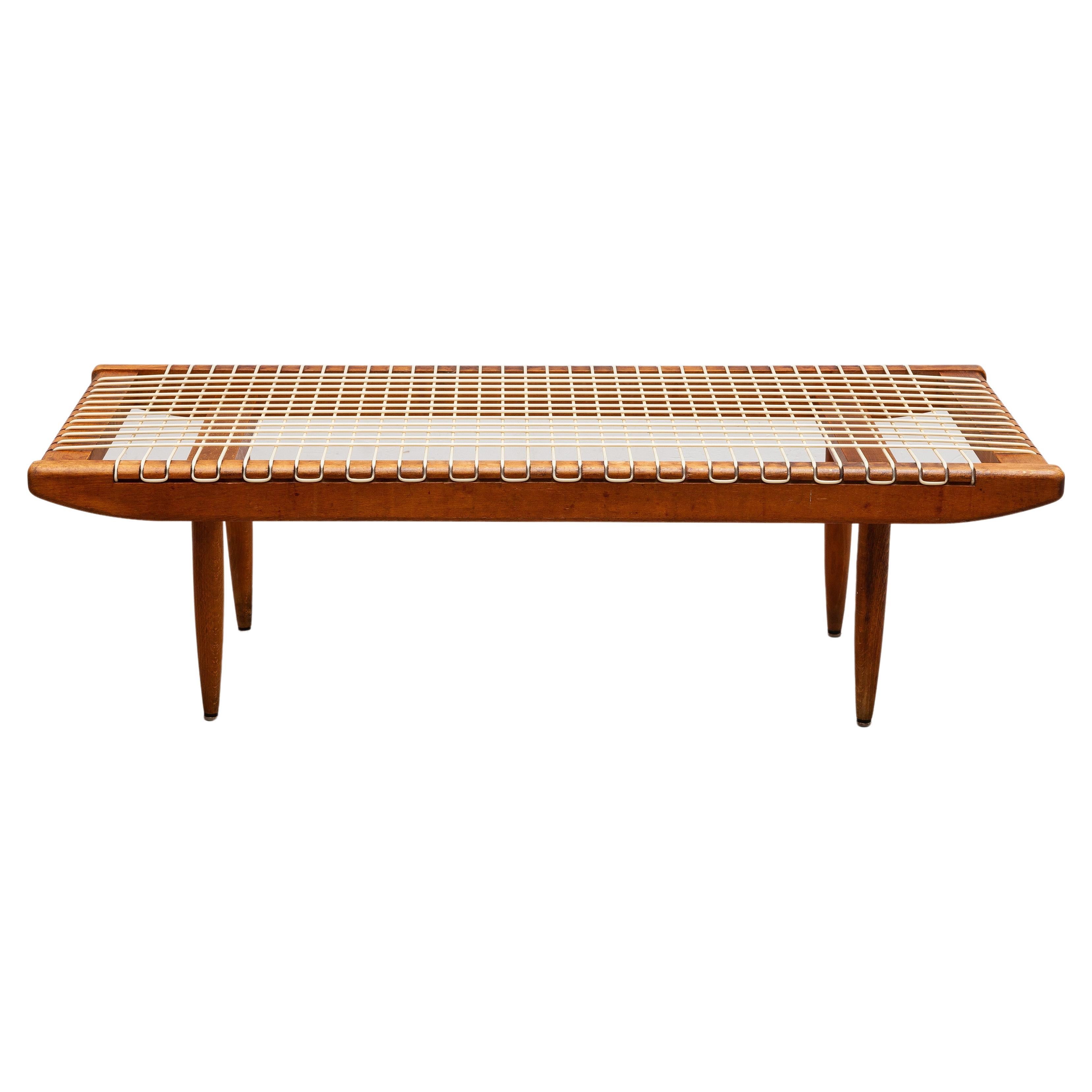 A rare decorative original coffee table designed by Georges Tigien for Pradera in the 1950s, France. Formed of solid teak and highly durable wire cable. The coffee-table is highly decorative and in original condition. The table works well as a side