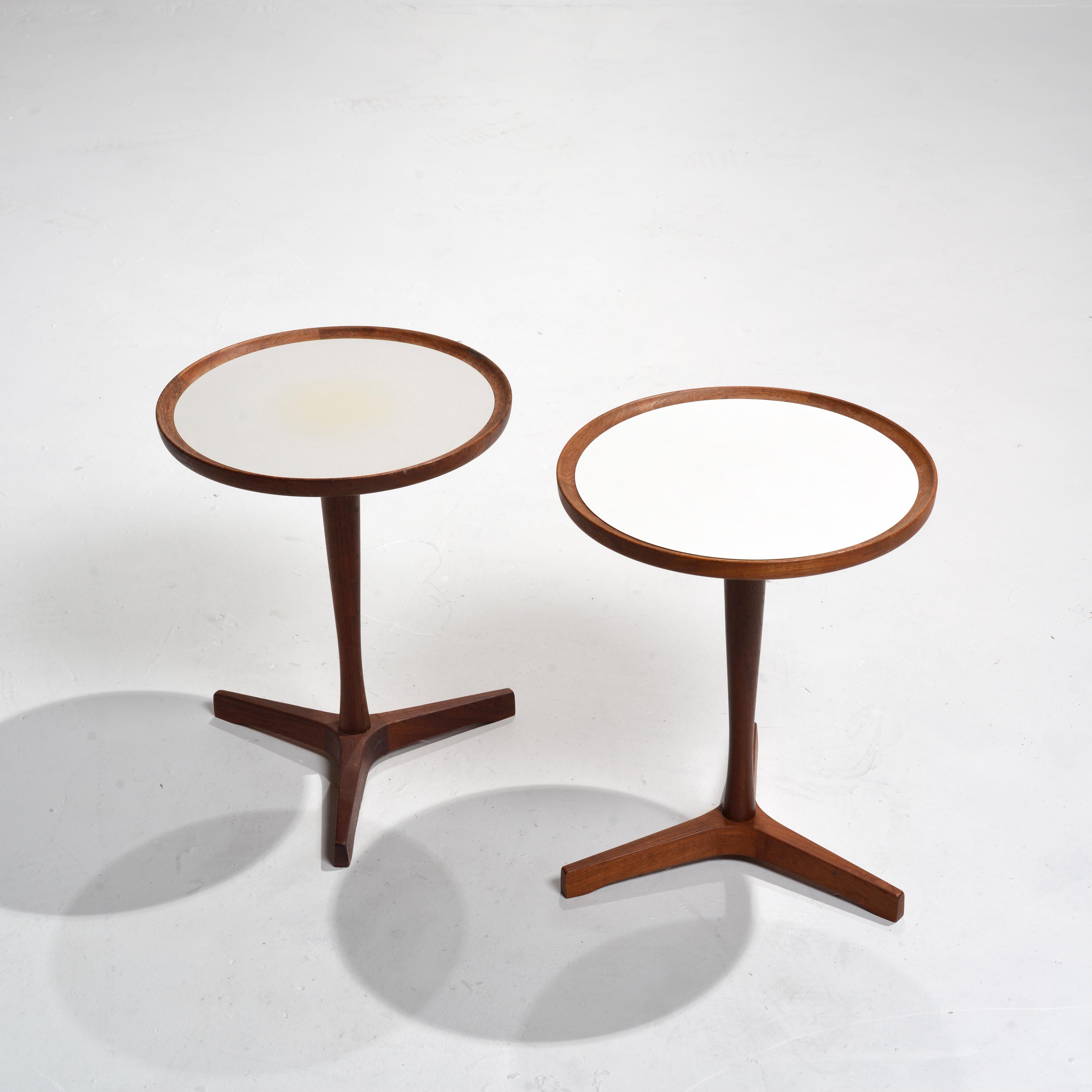 Rare teak end tables with white melamine tops by Hans C. Andersen, circa 1950s. These tables feature excellent detailing and craftsmanship. We have 4 in stock. Price per table. 


 